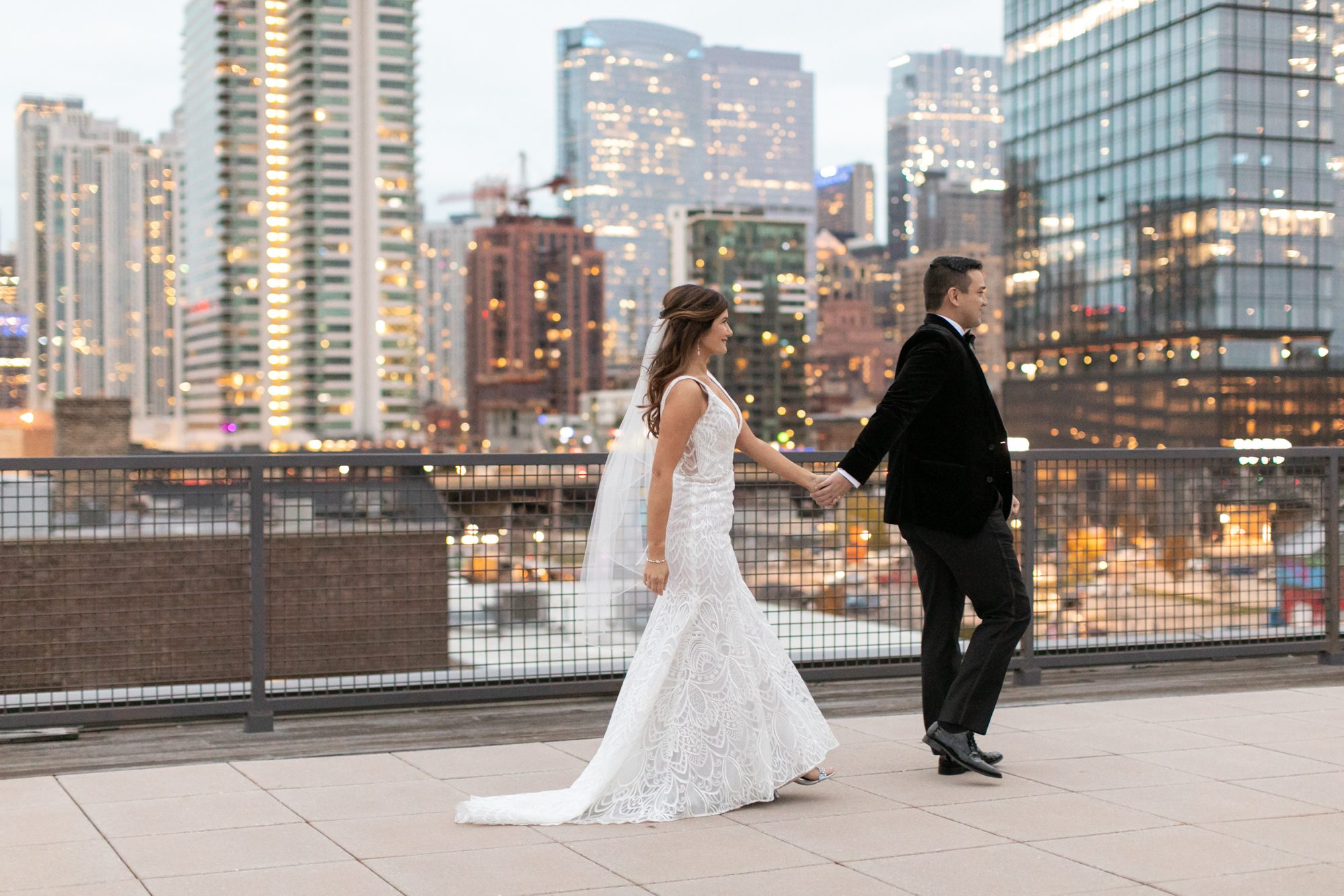 the bride and groom posed with the Chicago Skyline