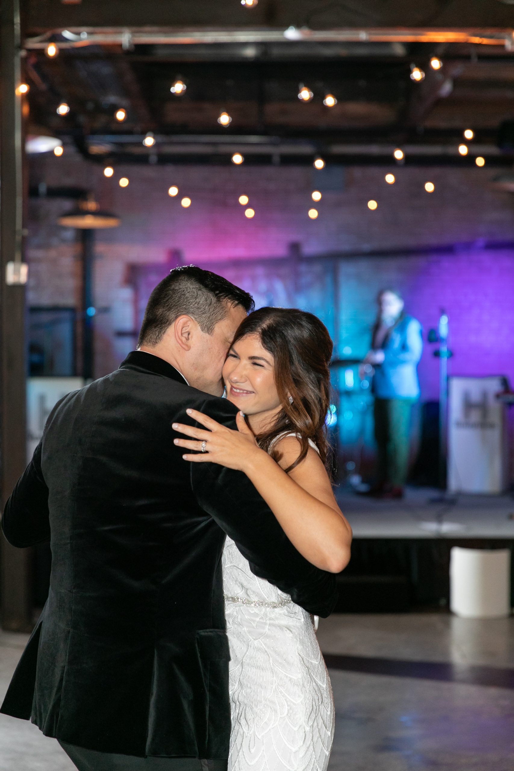 the bride and groom shared a sweet first dance at their Morgan Manufacturing wedding