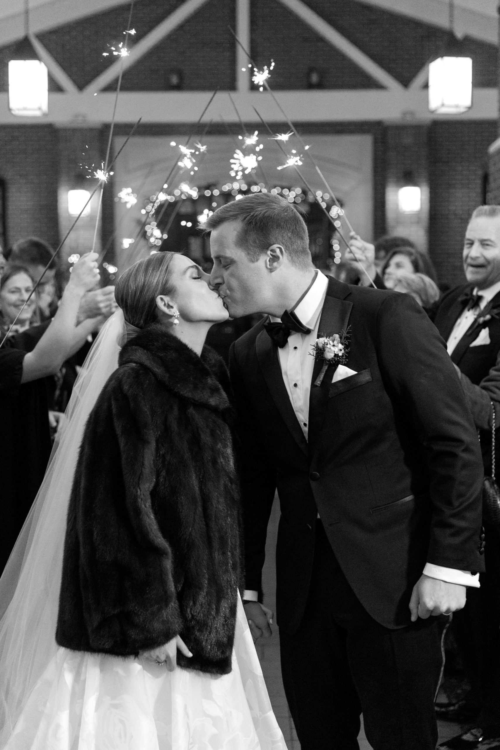 the bride and groom had a sparkler exit at their Chicago winter wedding