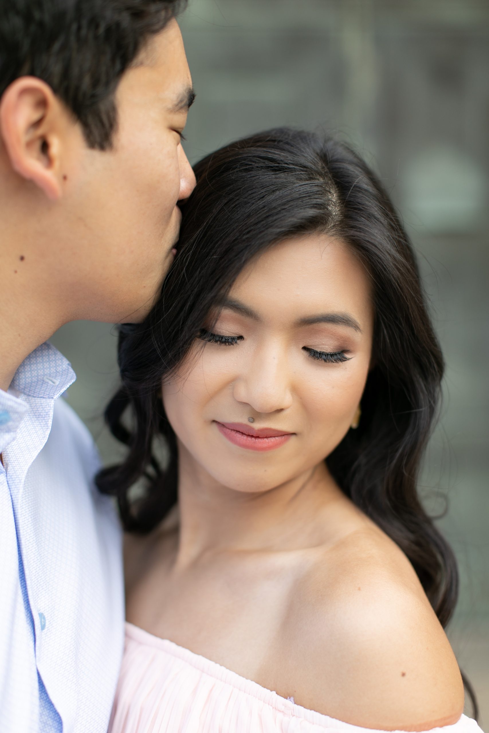 the man kissed the woman during the Chicago summer engagement photos