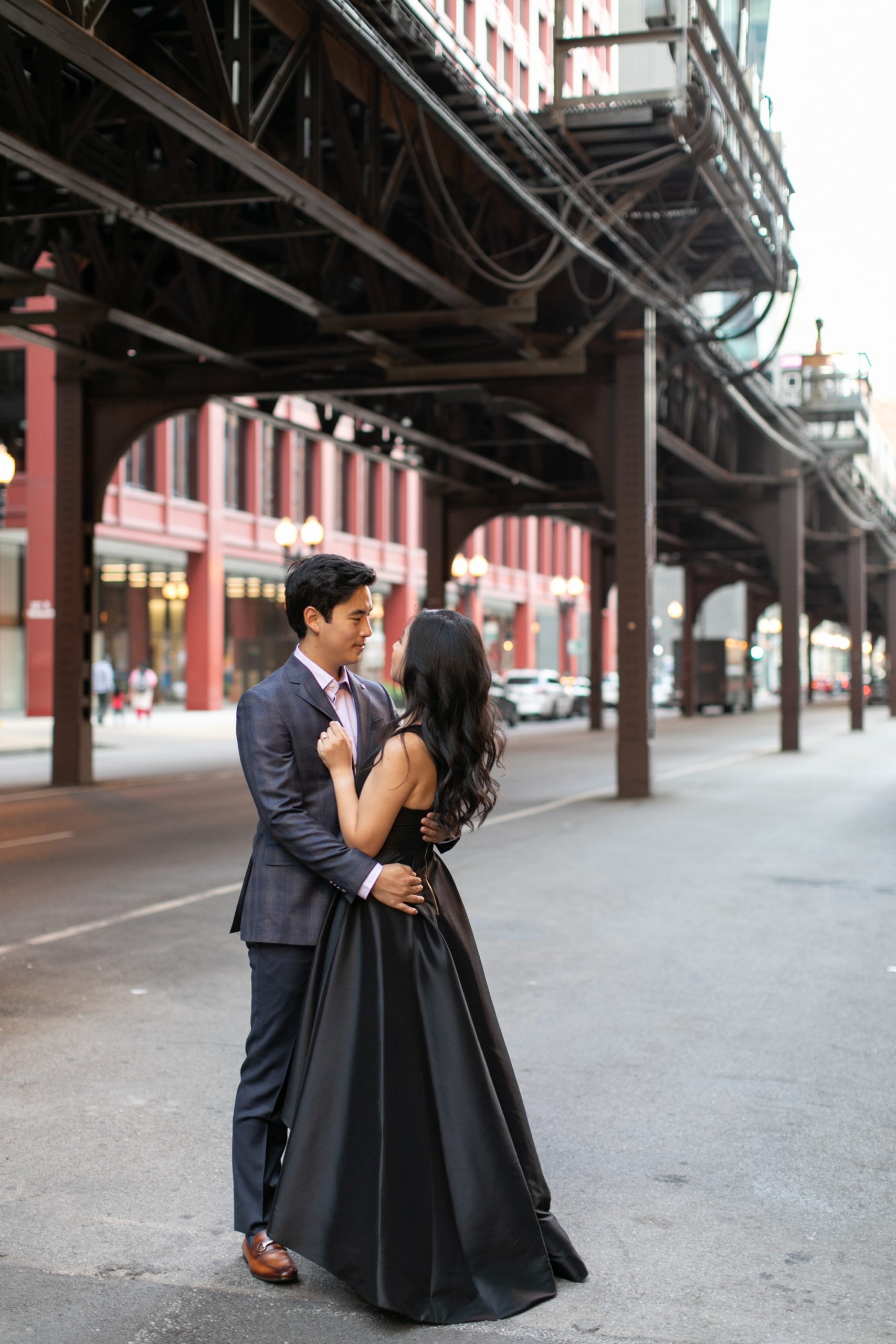 the couple posed in West Fulton Market for their summer engagement photos