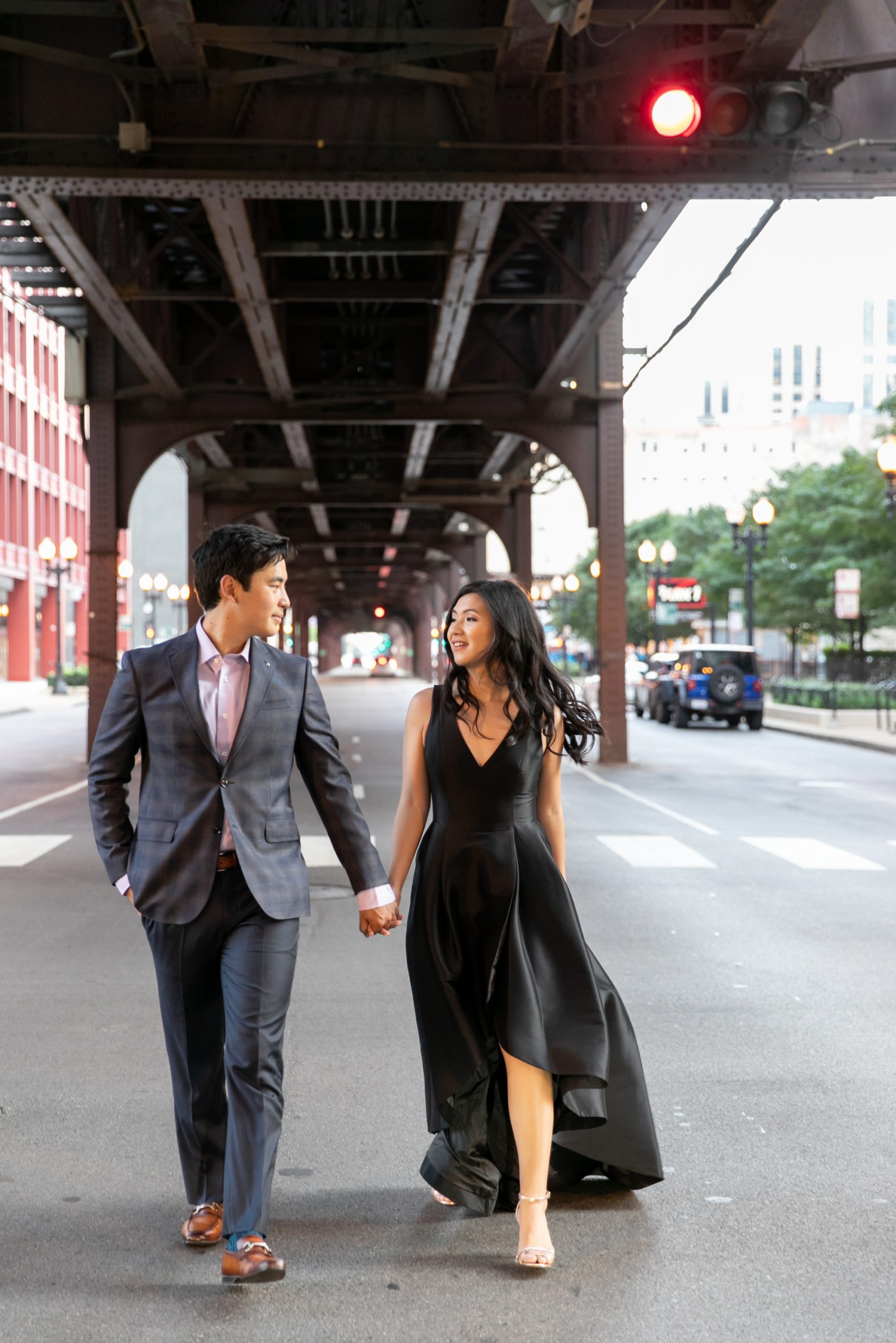 the couple smiled at each other during their summer engagement photos in Chicago