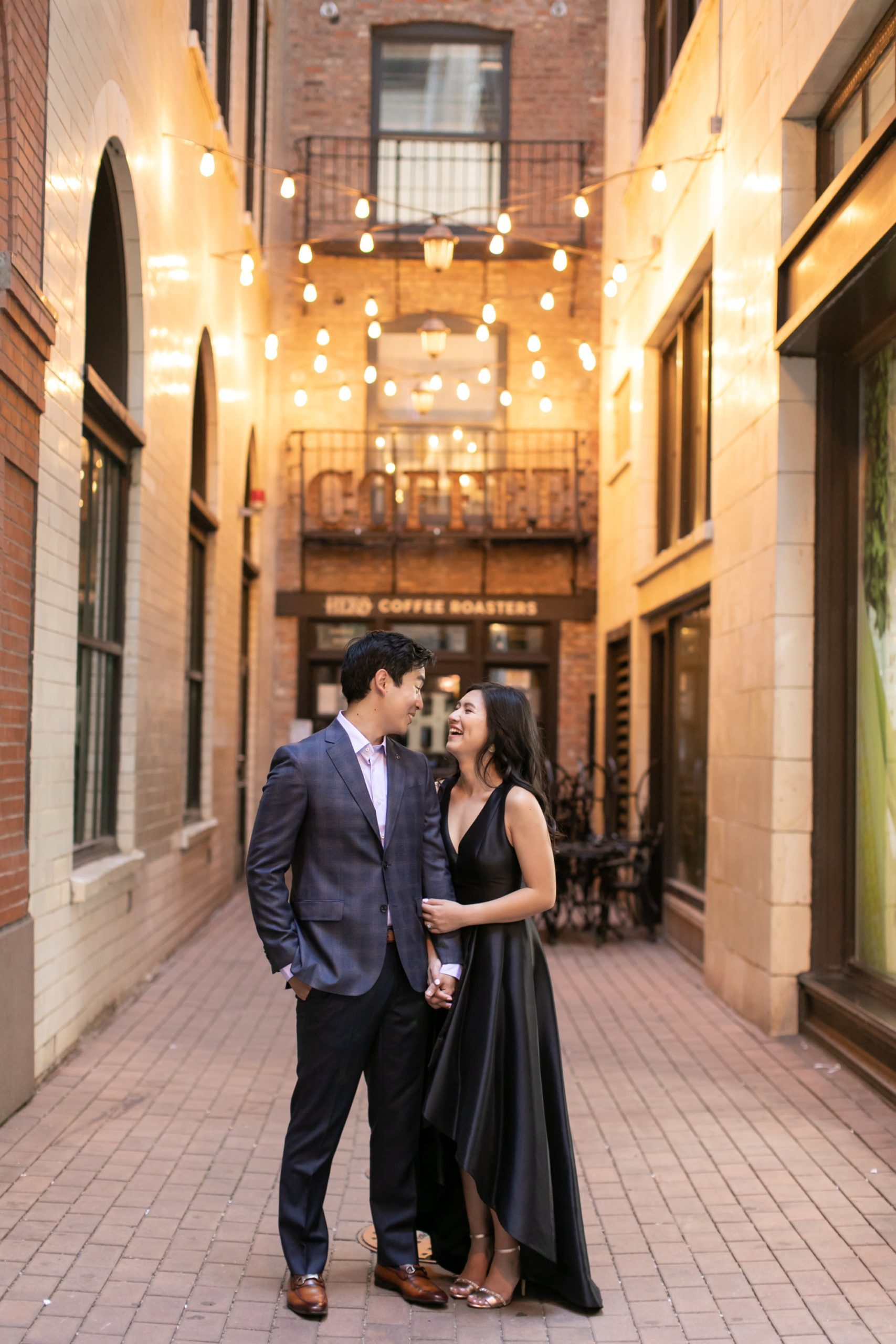 the couple smiled at each other in West Fulton Market during their Chicago engagement photos