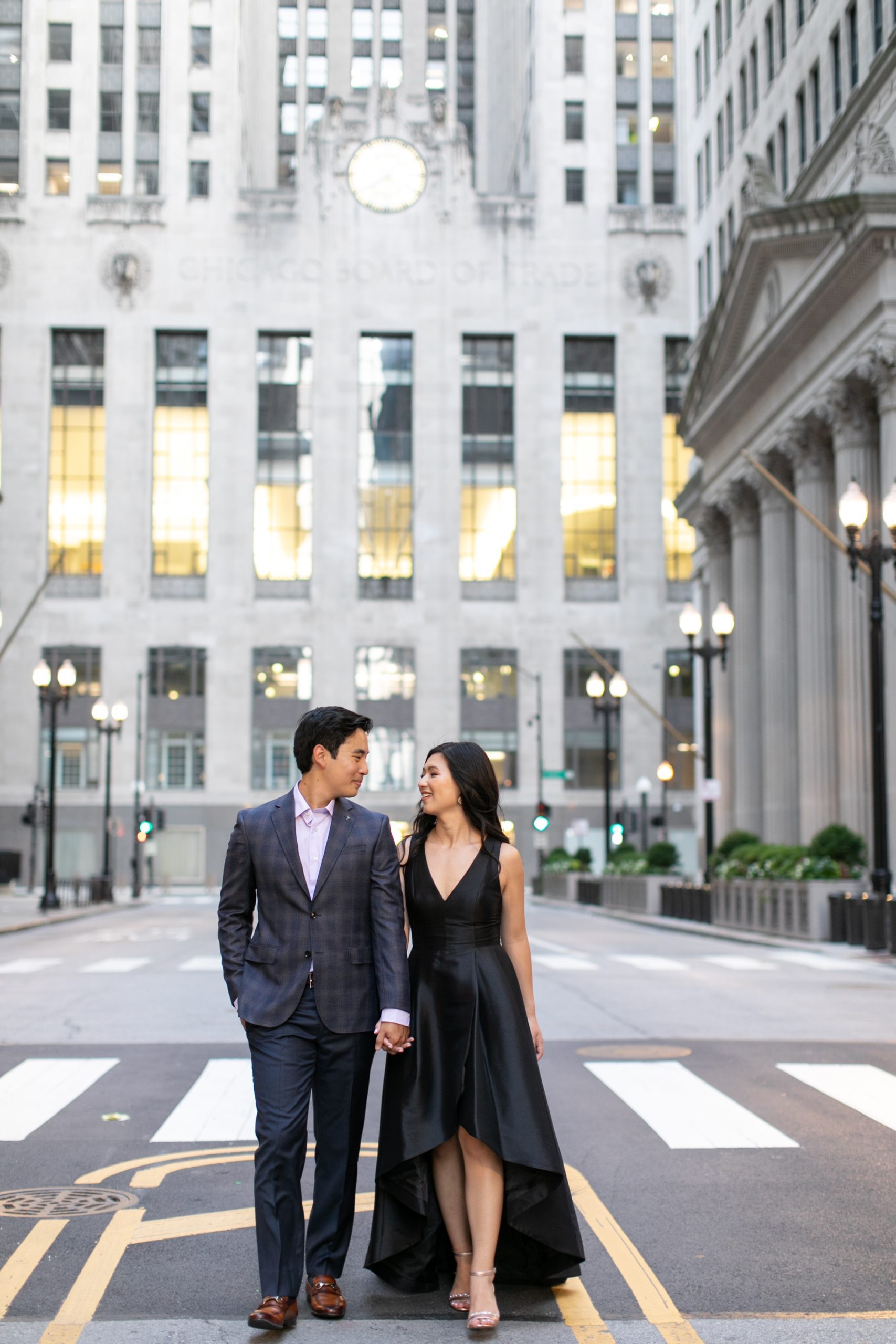 the couple walked in downtown Chicago during their summer engagement photo shoot