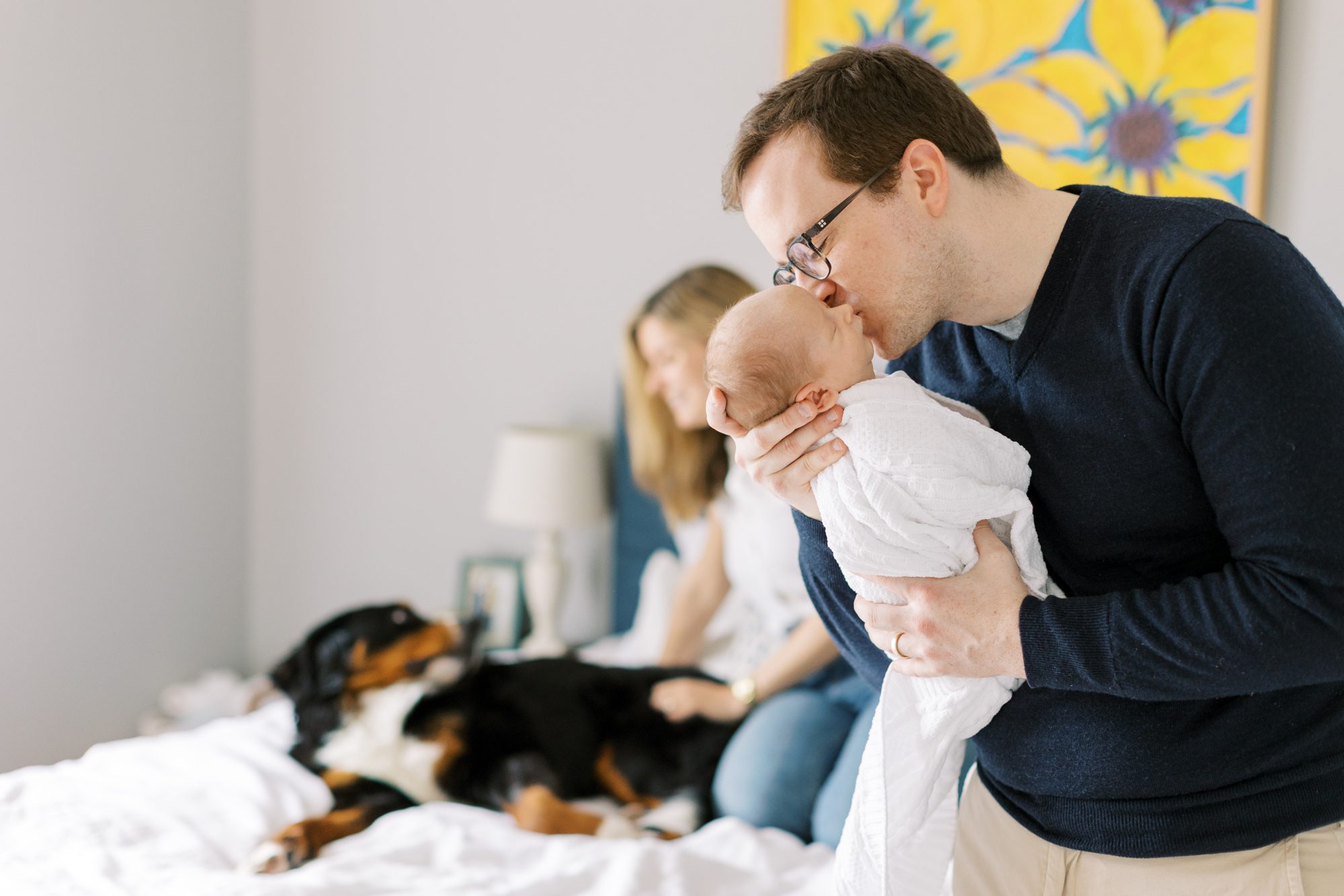 dad kisses baby during Chicago at home photoshoot