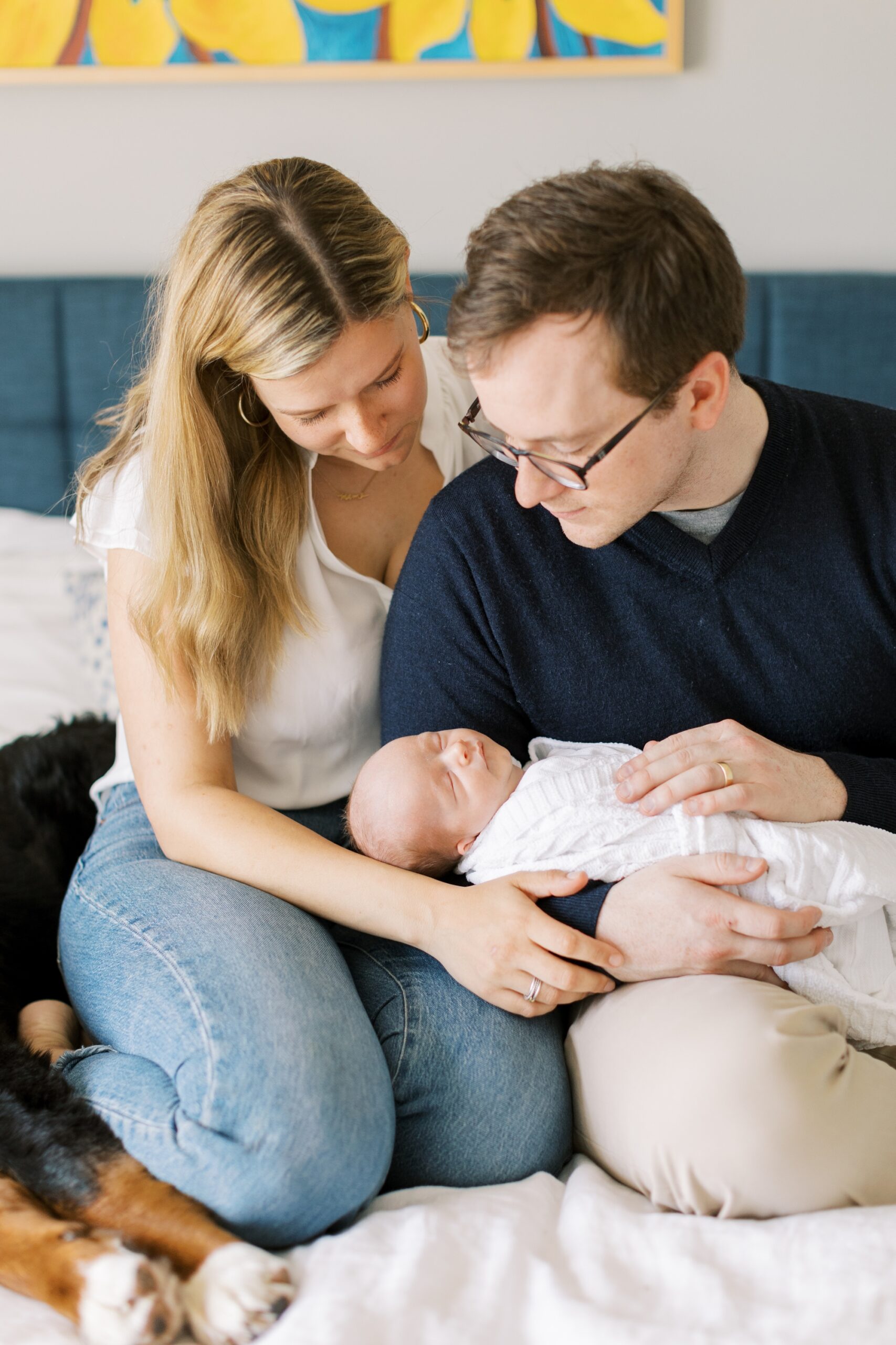 parents with their baby during their at-home newborn session