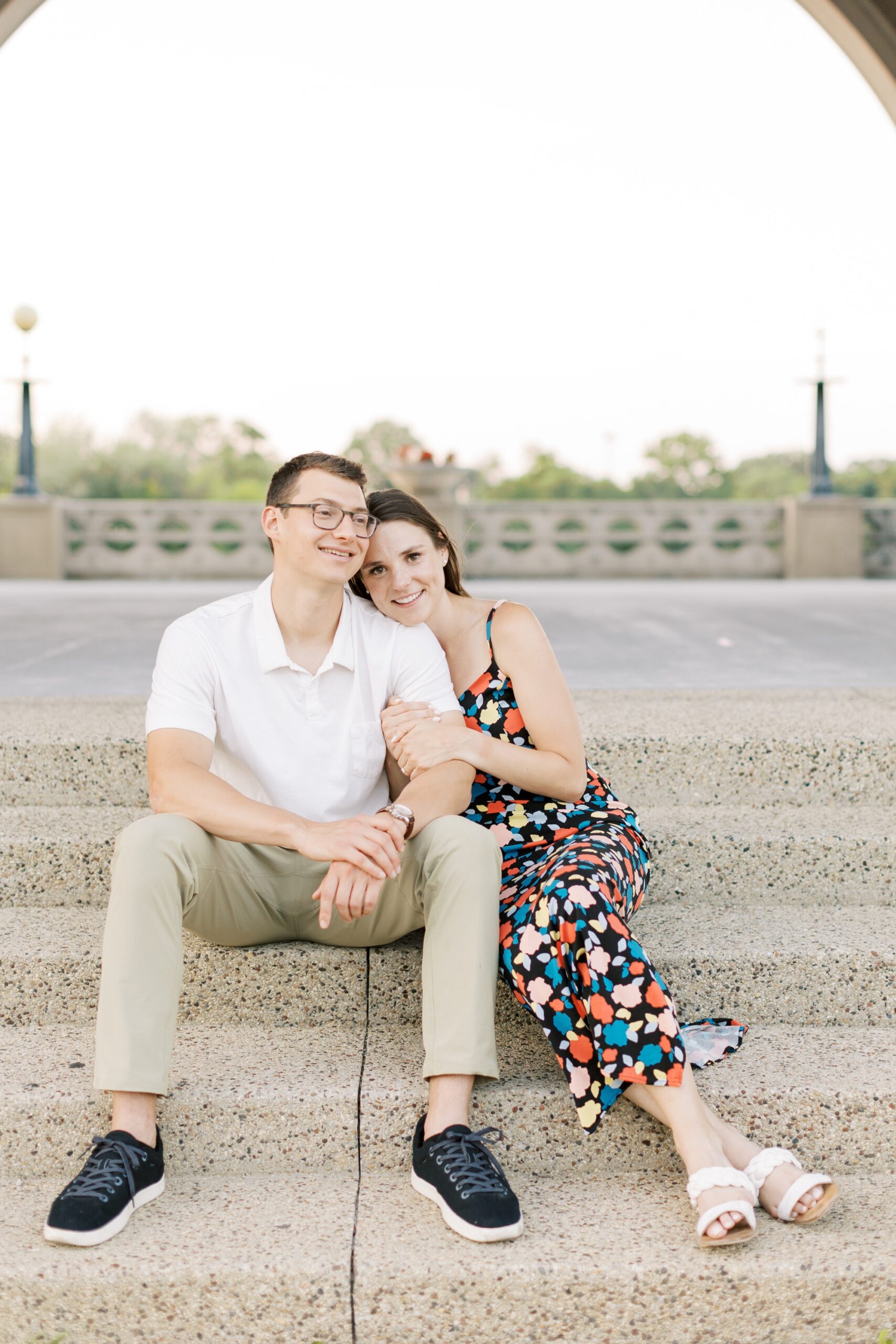 couple sits together during Chicago engagement photoshoot