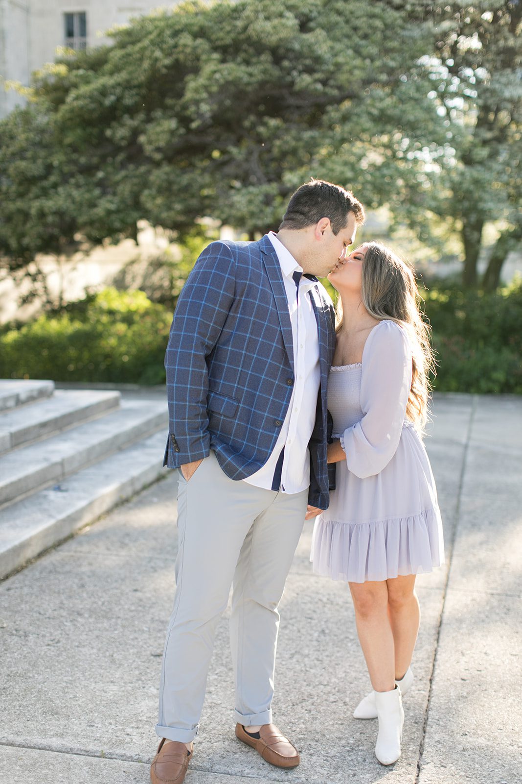 man and woman kiss during Chicago engagement photos