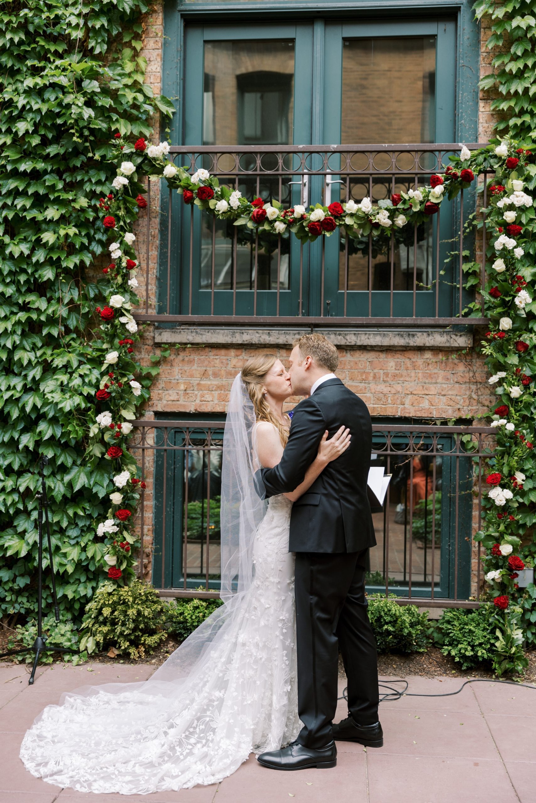 Bride and groom kissing at the Ivy Room wedding
