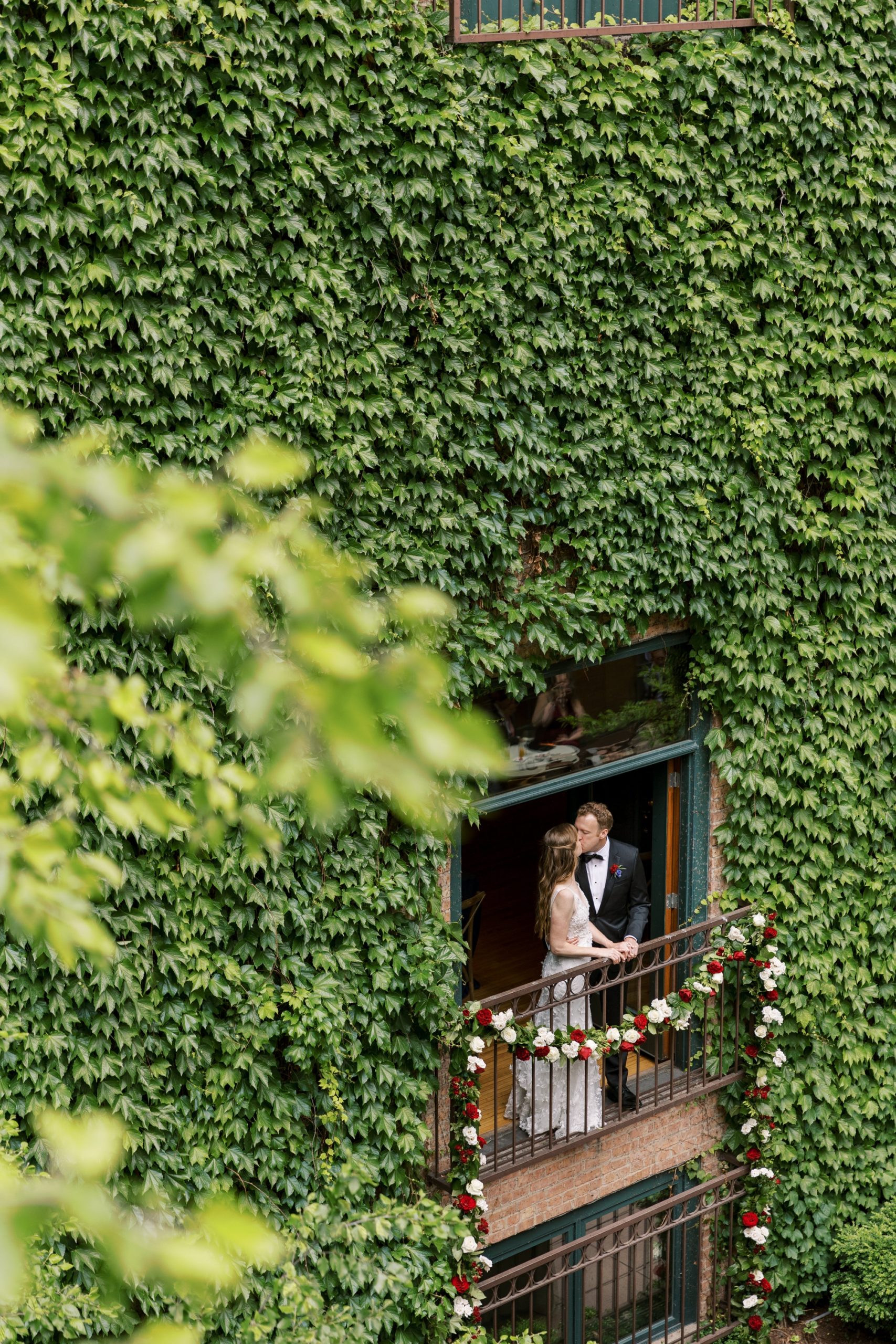Bride and groom pose at their Ivy Room wedding