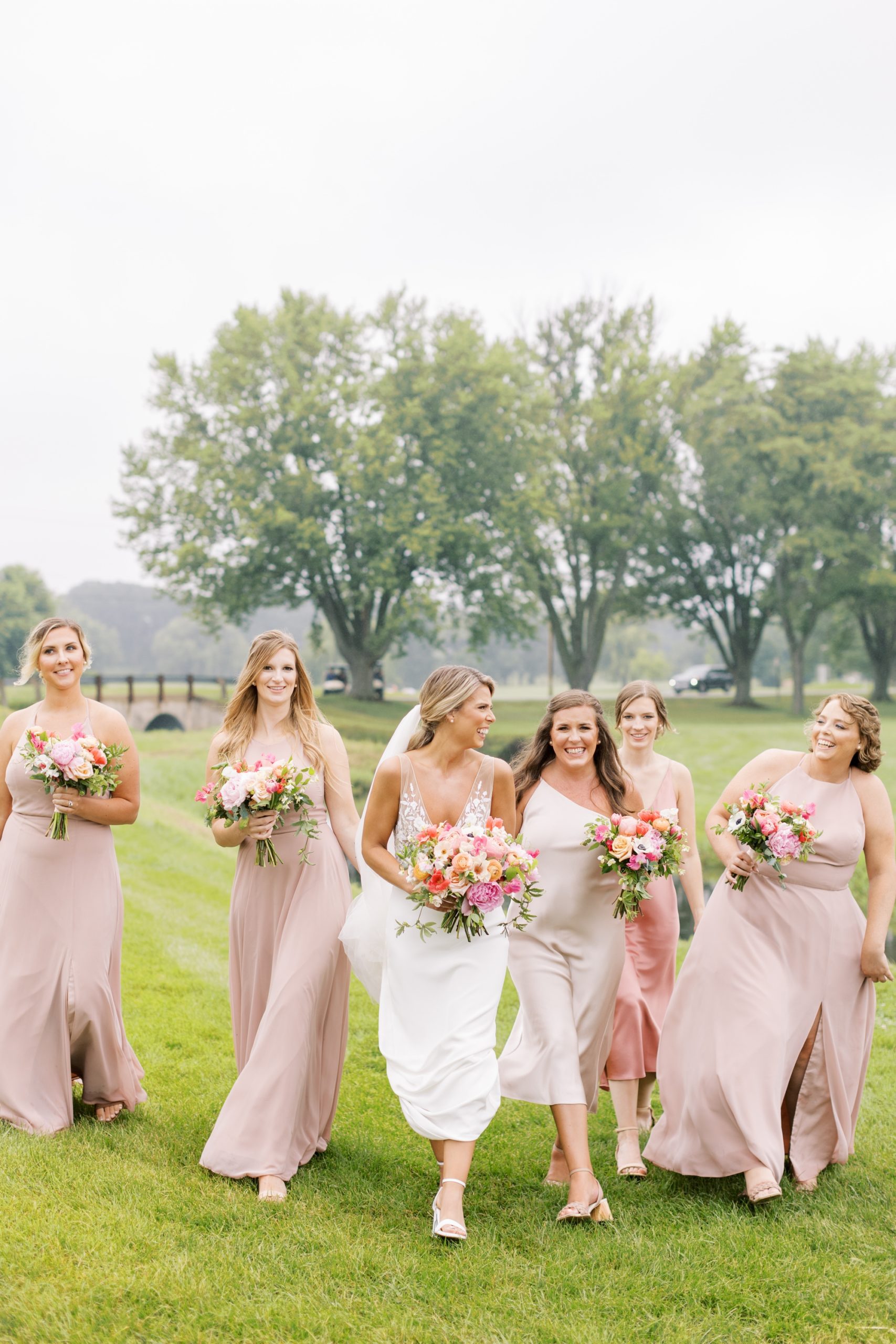 Bridesmaids in pink bridesmaids dresses at the Lake Windsor Country Club wedding