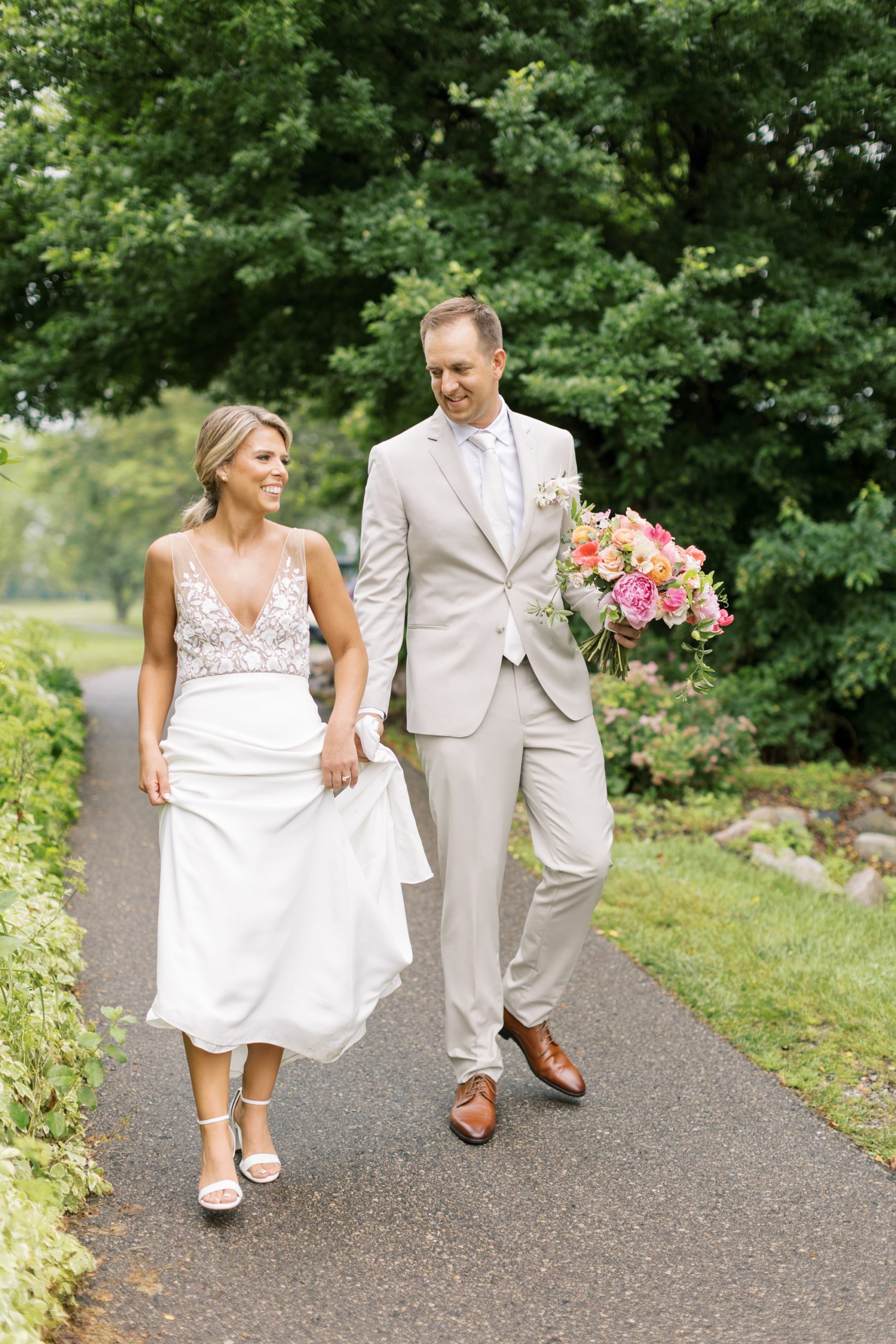 The bride and groom laughed at their Lake Windsor Country Club wedding