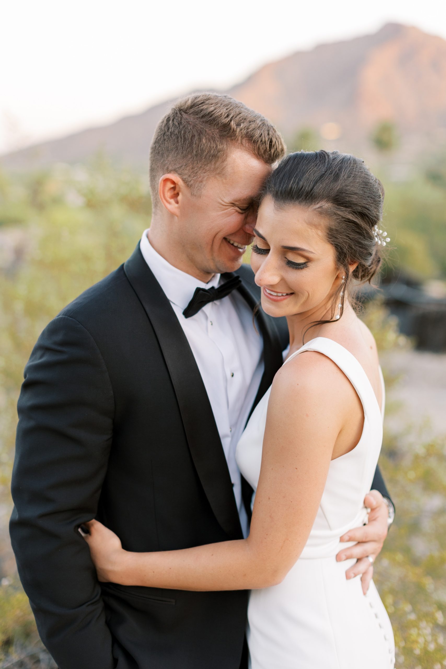 Bride and groom pose at their Camelback Inn in Scottsdale wedding