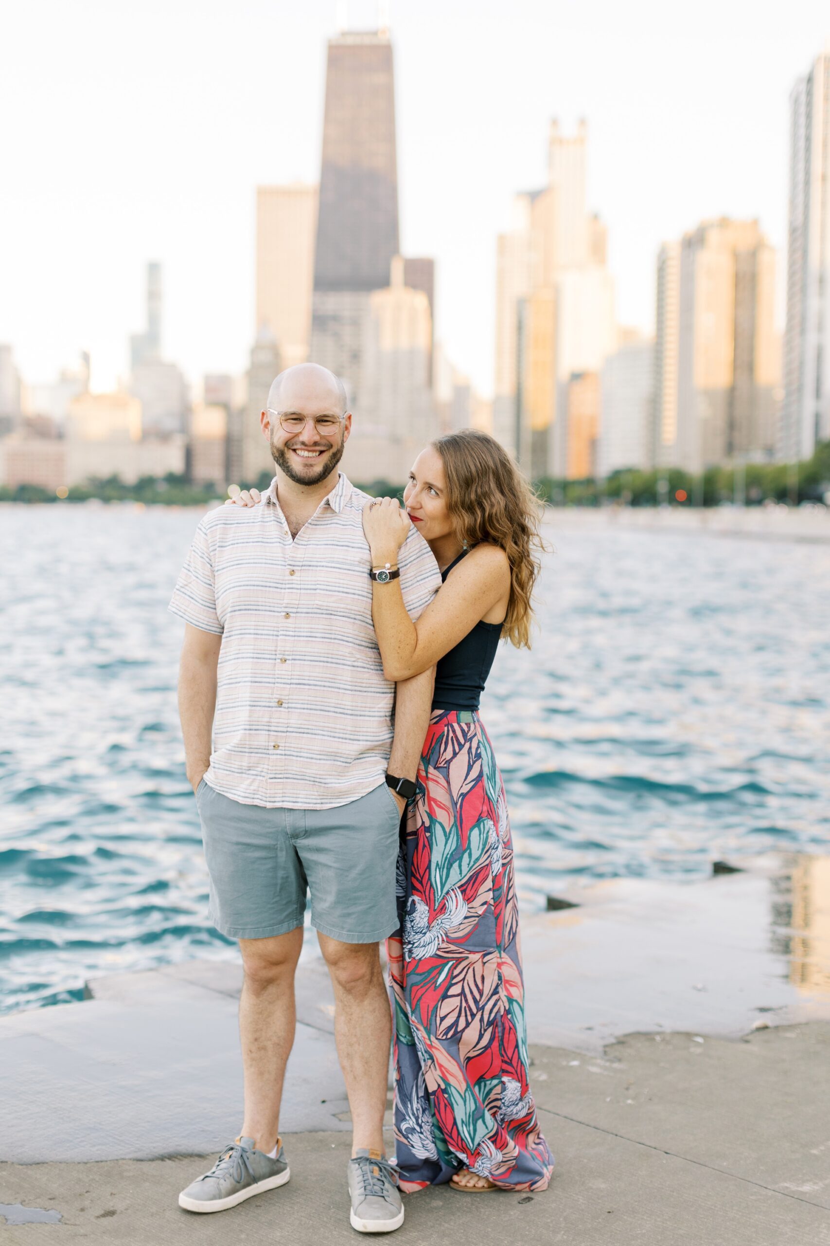 The couple smiled at each other during the Chicago skyline engagement photoshoot