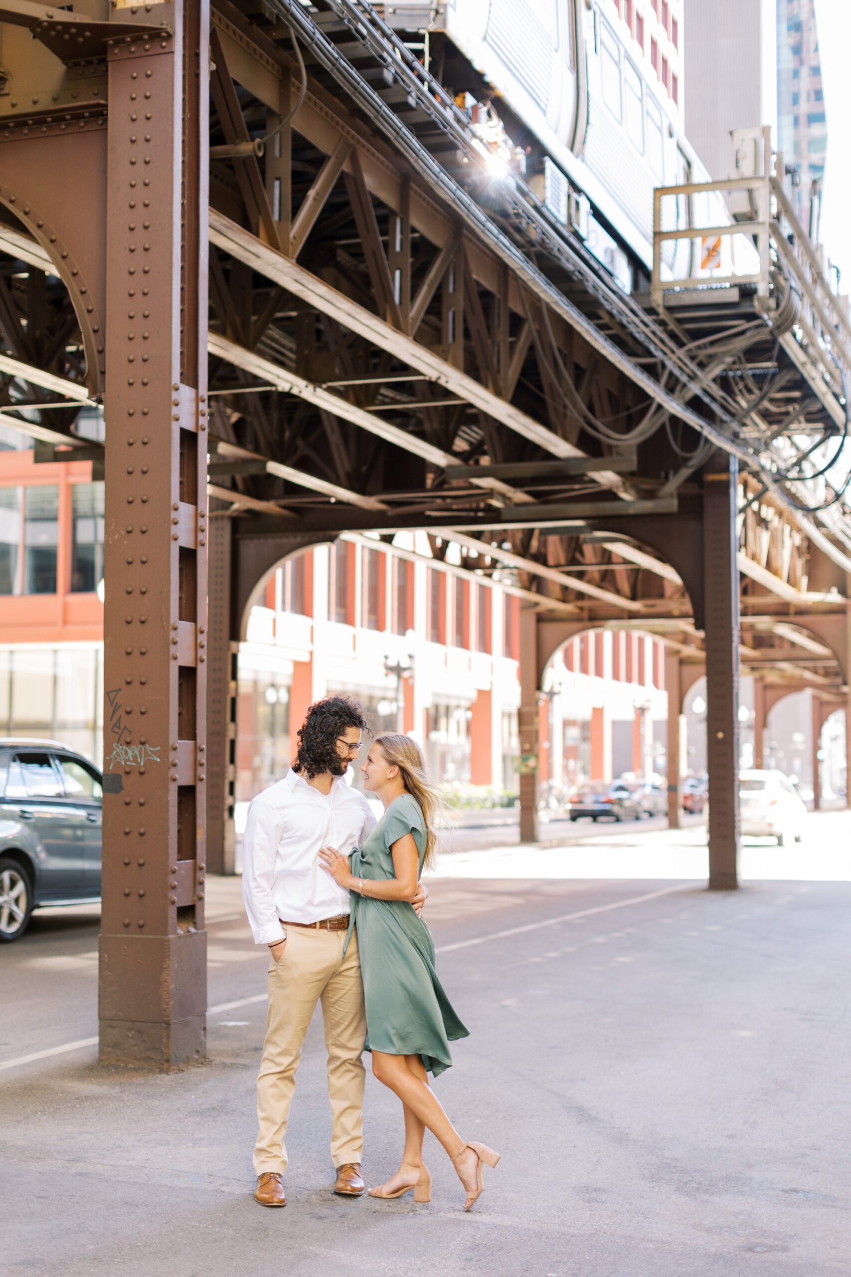 Man and woman kiss during West Fulton Market engagement photoshoot
