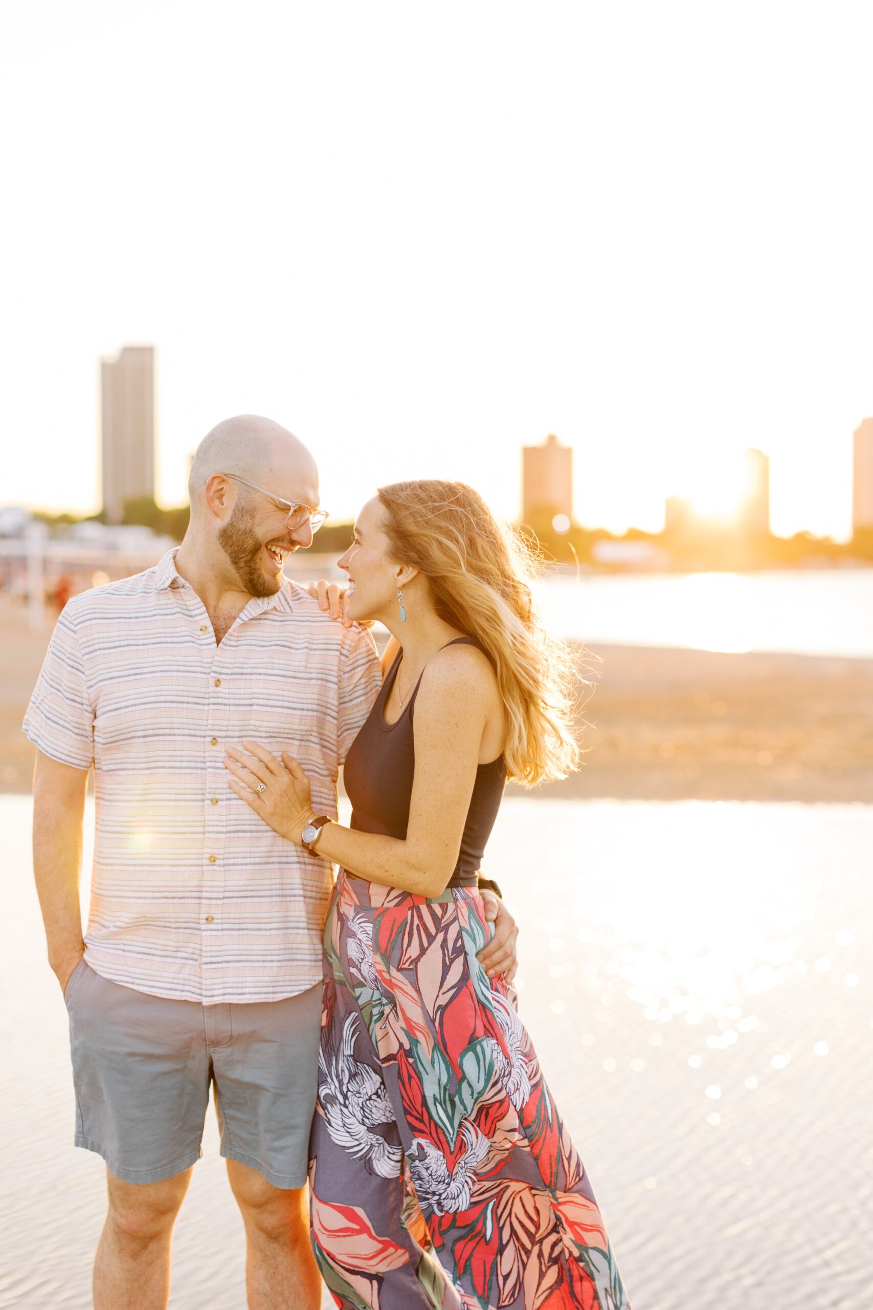 The couple smiled as the sun set behind the Chicago skyline