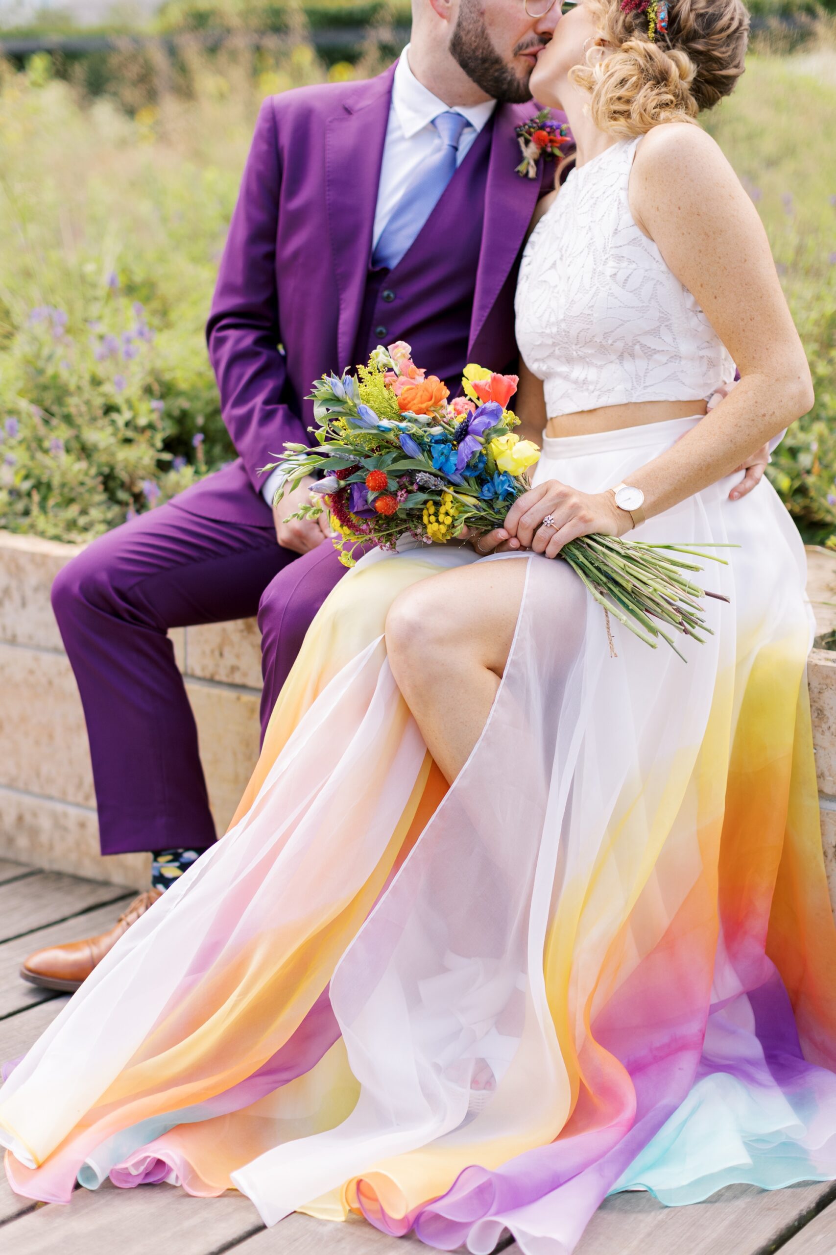 The bride wore a colorful wedding dress and carried a colorful wedding bouquet that fit the colorful wedding palette
