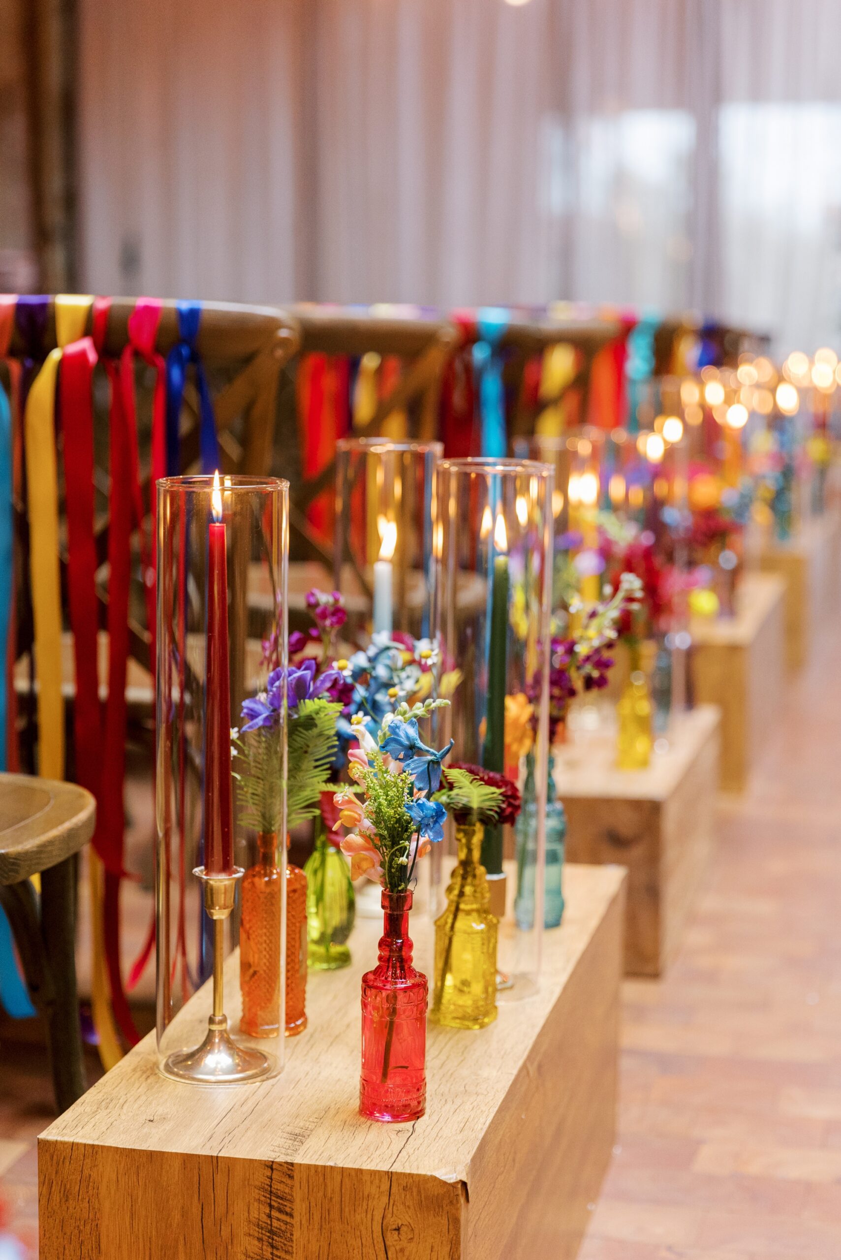 The colorful wedding aisle markers fit the colorful wedding palette