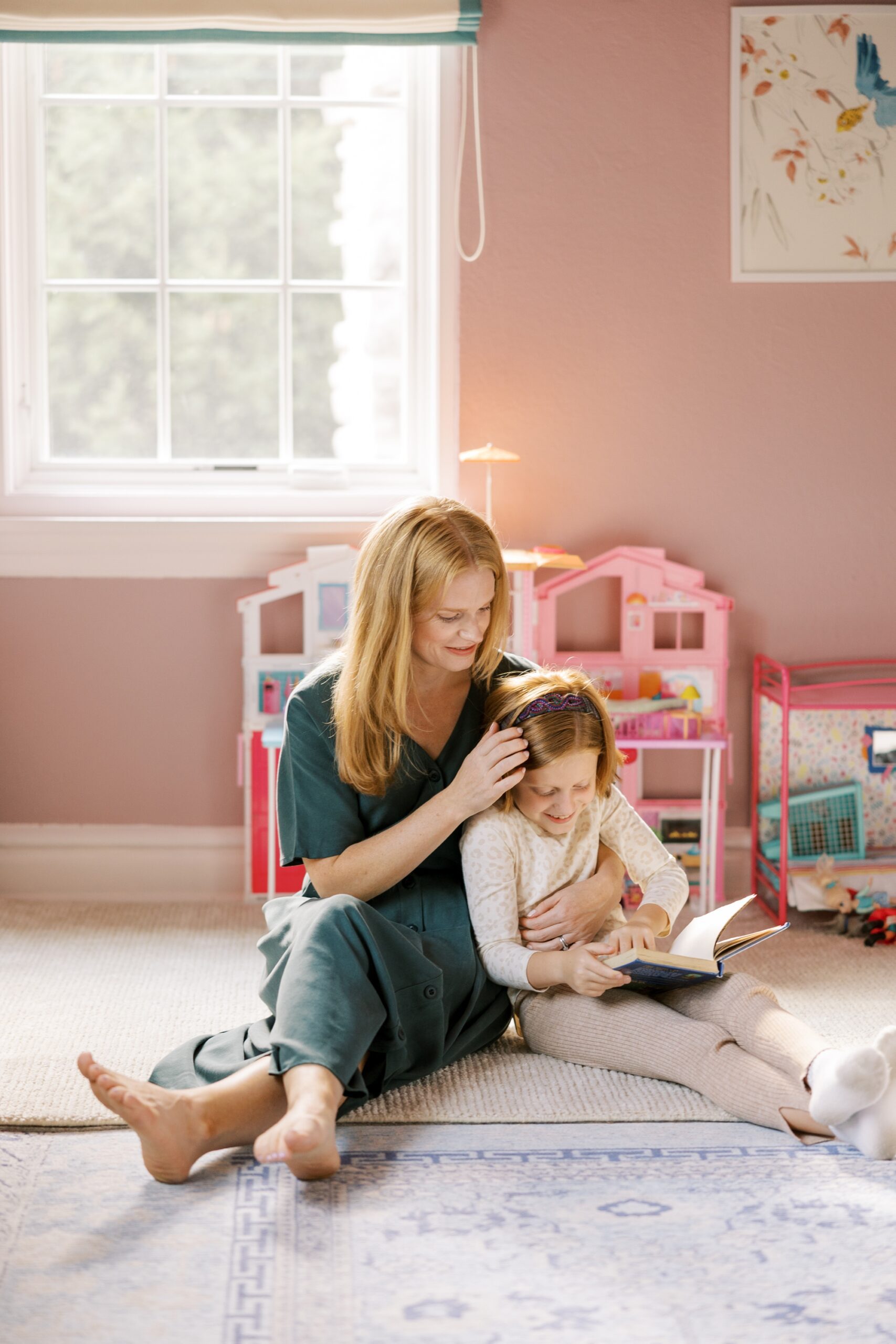 A mom and daughter read together during the Chicago home lifestyle photos