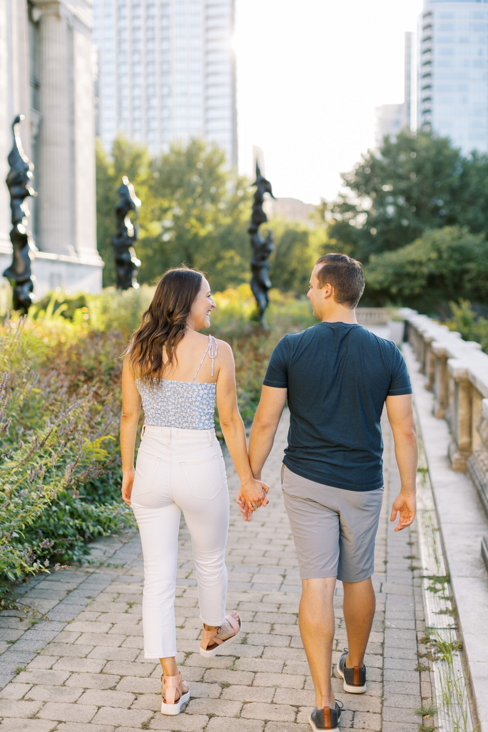 The couple held hands during their Chicago Museum Campus engagement photoshoot