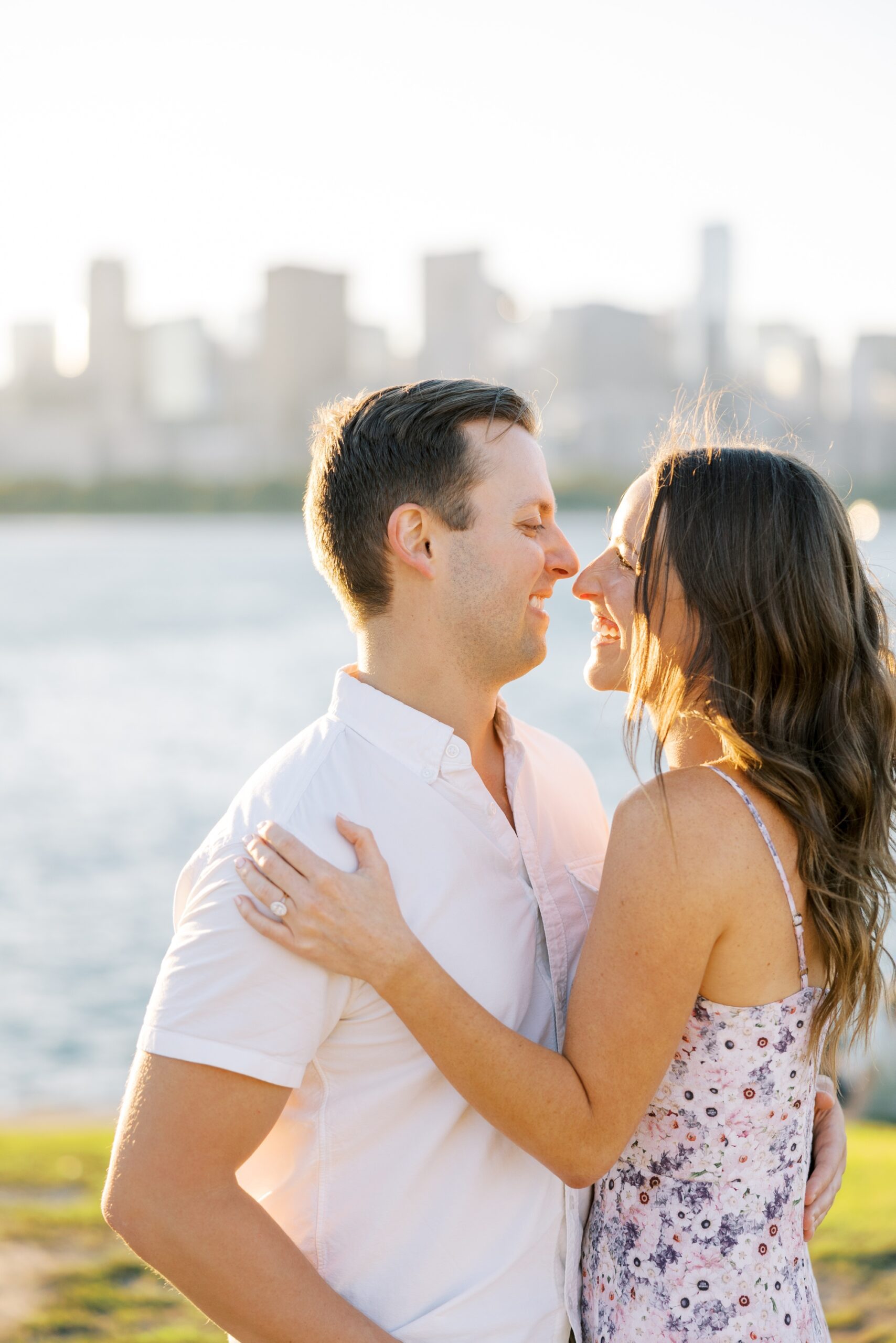 The couple smiled in front of the Chicago skyline during their Museum Campus engagement photos
