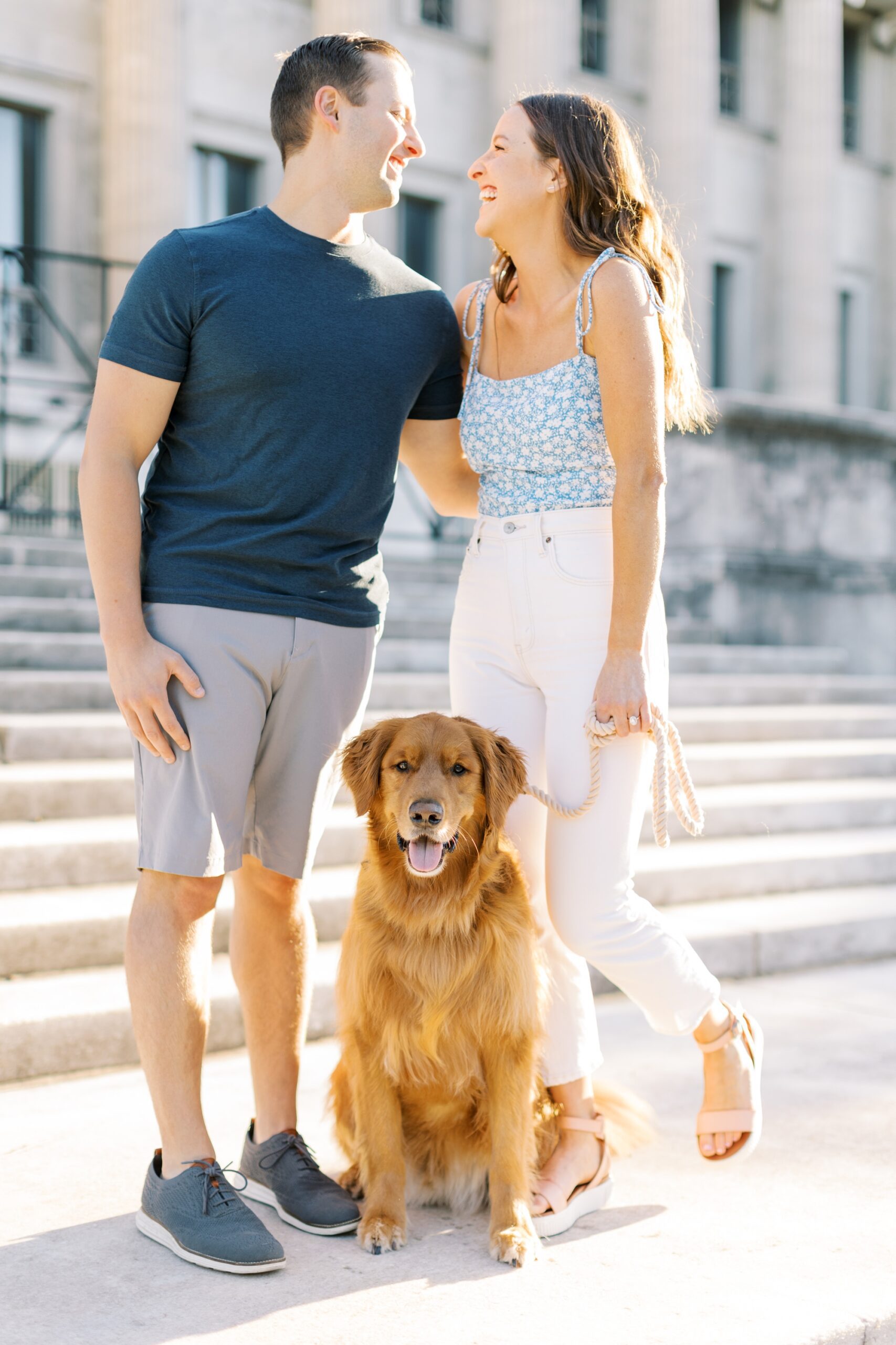 The couple posed with their dog for engagement photos with a dog