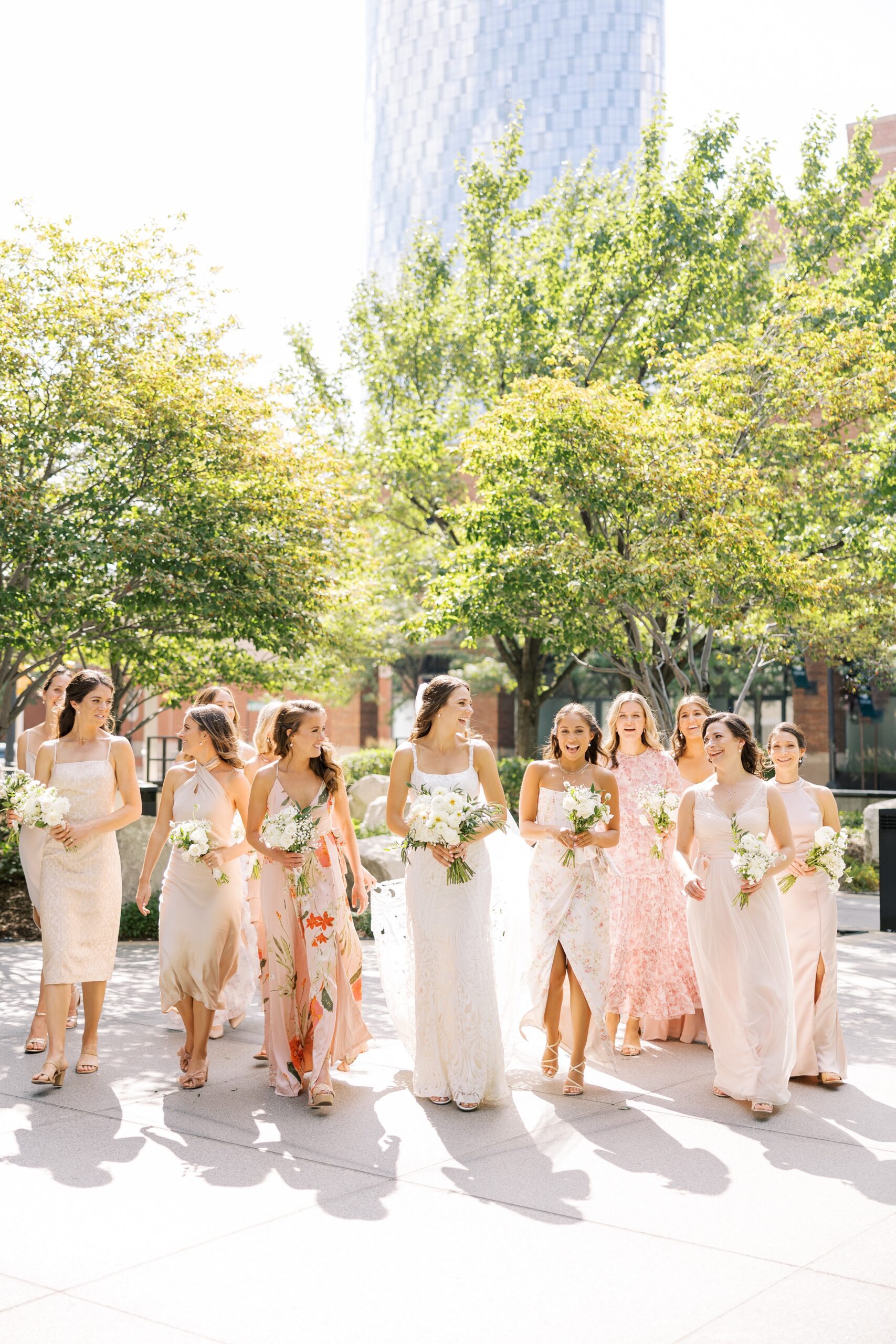 bride and bridesmaids wearing mismatched dresses before galleria Marchetti wedding