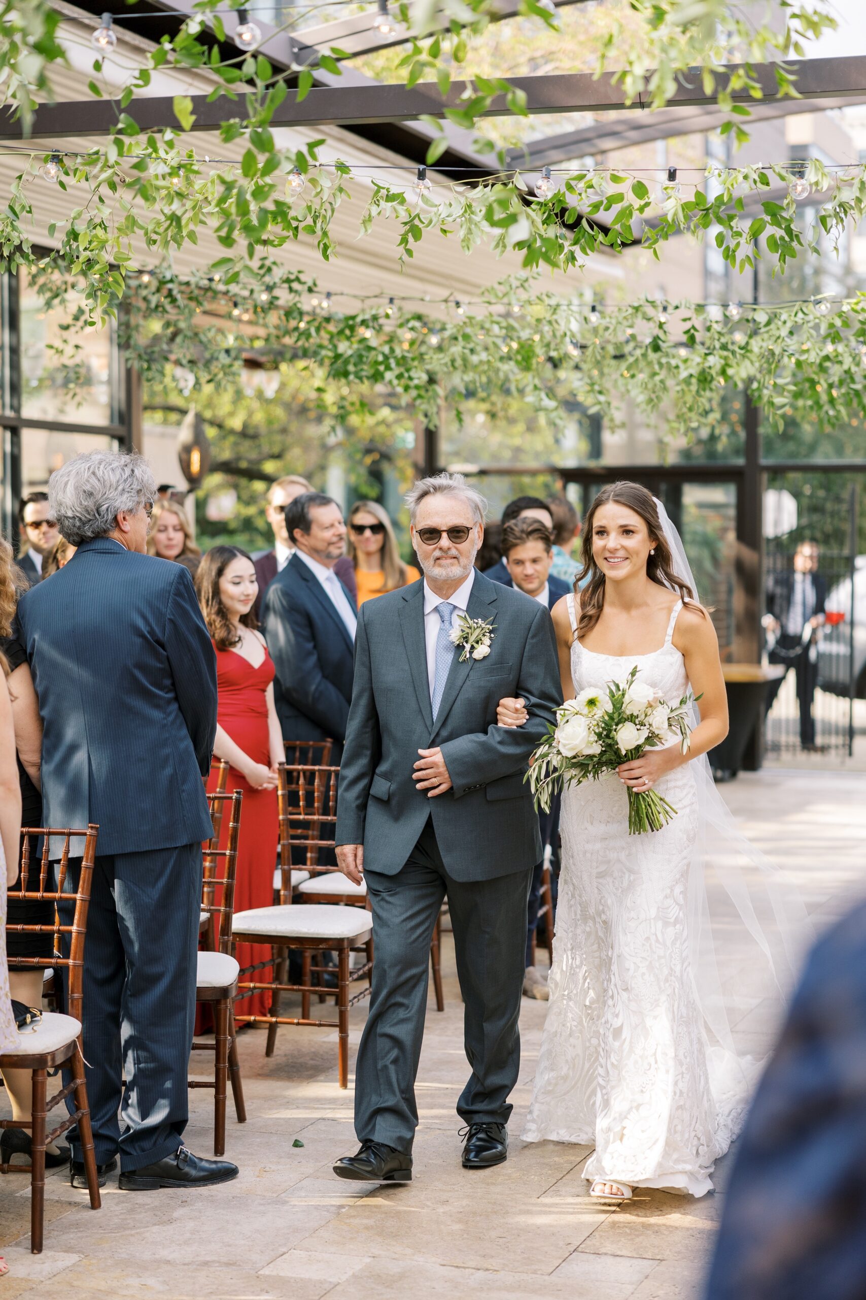 bride and father of the bride walking down the aisle at galleria Marchetti wedding