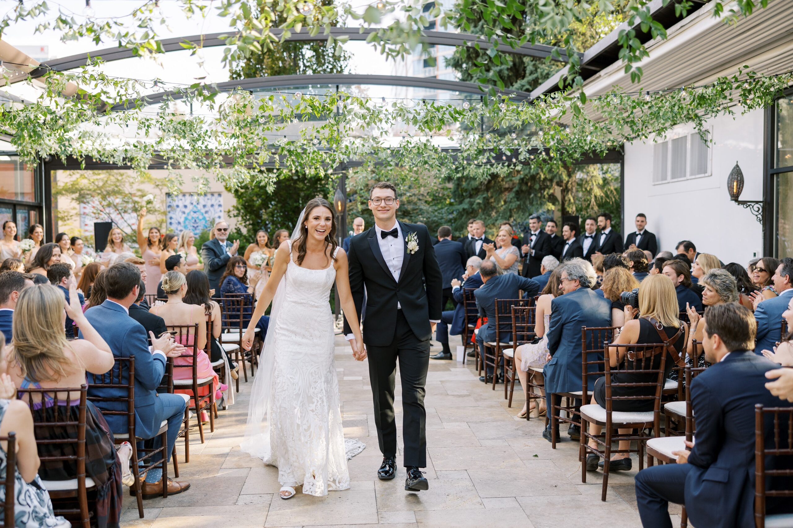brie and groom exit their galleria Marchetti outdoor wedding ceremony