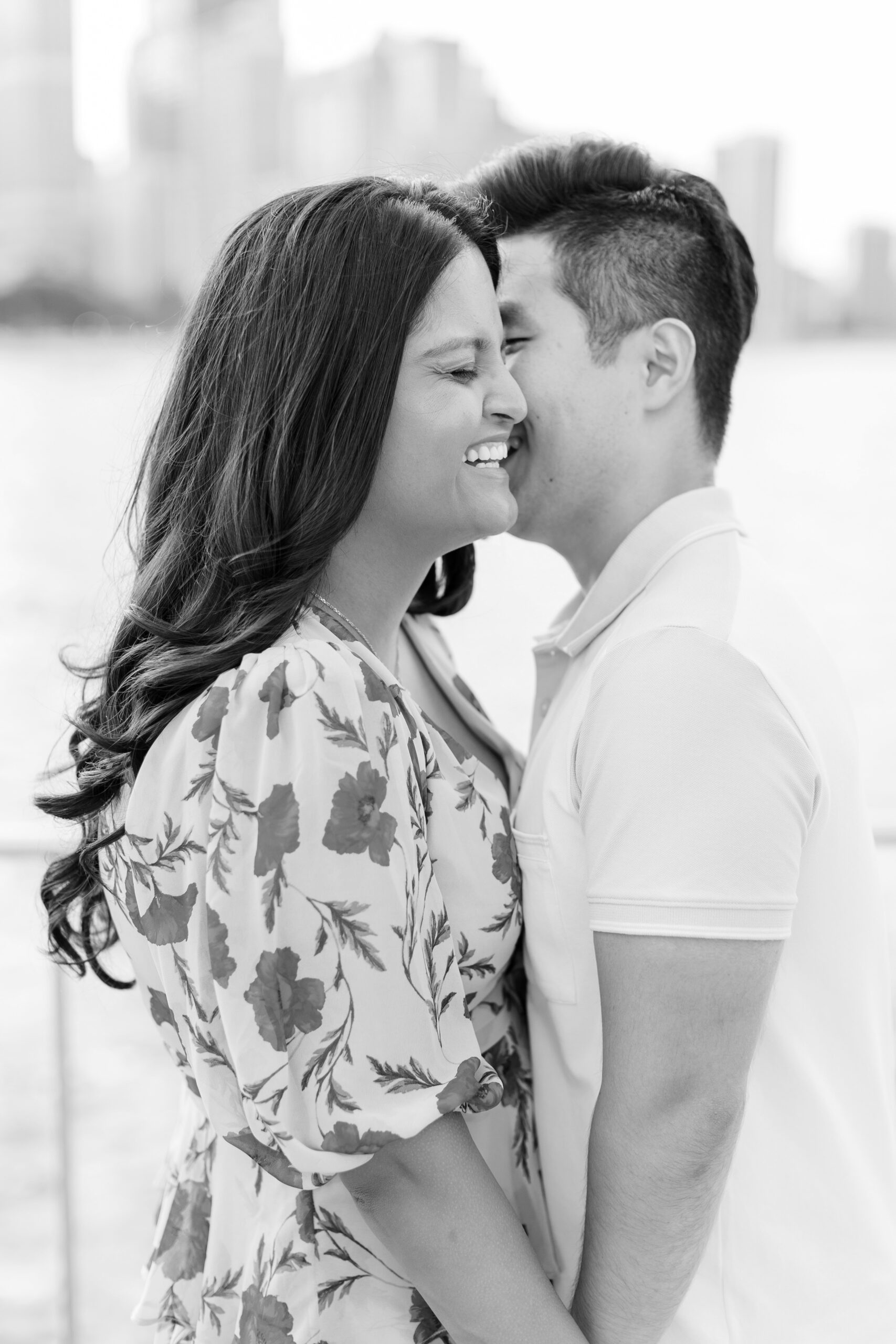 Man and woman laugh during outdoor engagement photos in chicago