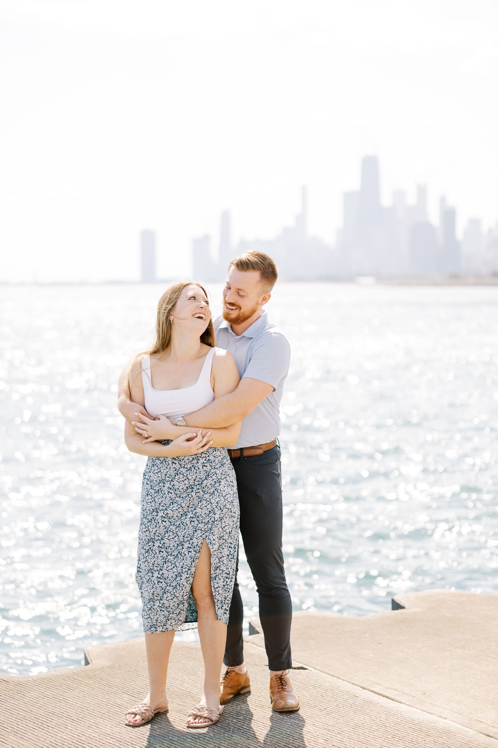 Man and woman hug after Chicago lakefront proposal