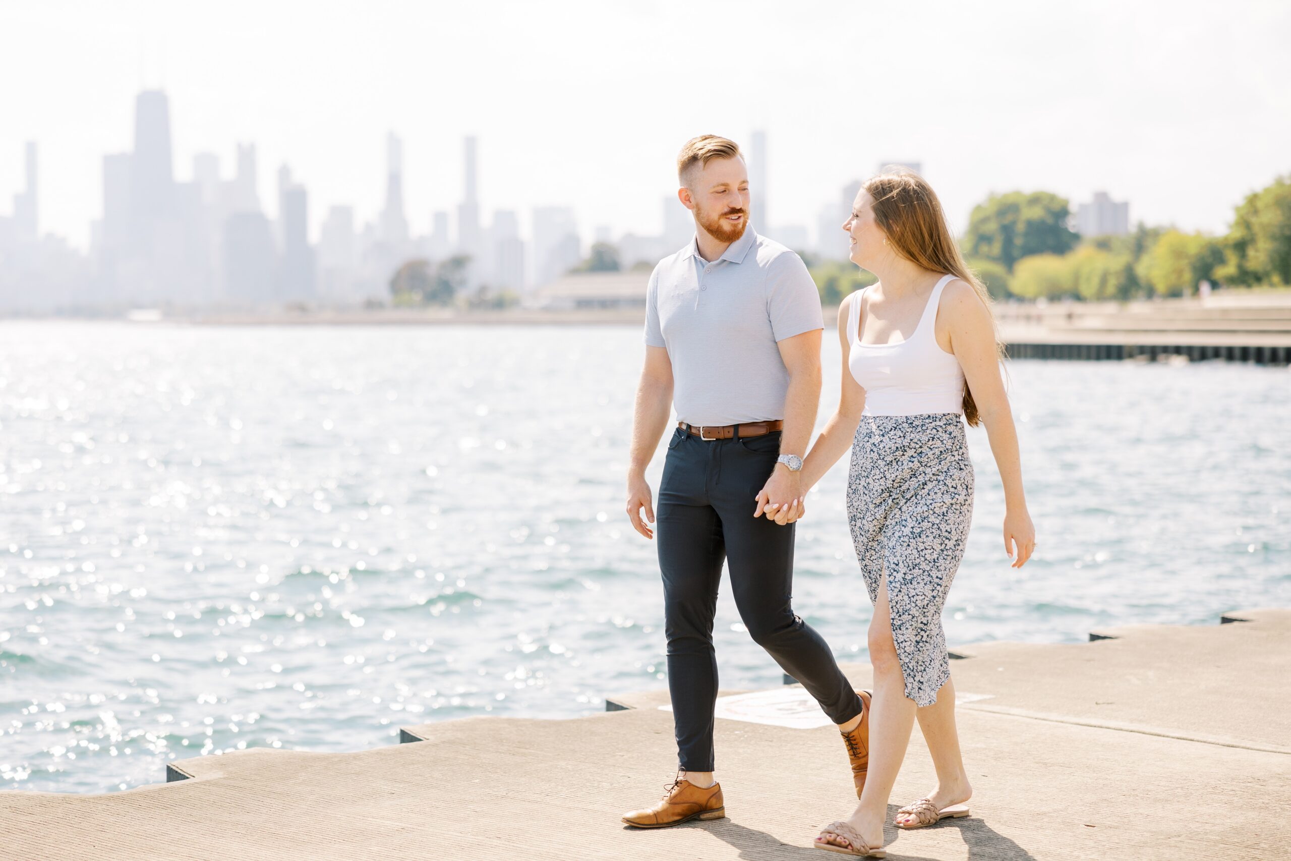 Woman and man walk together after their Chicago proposal