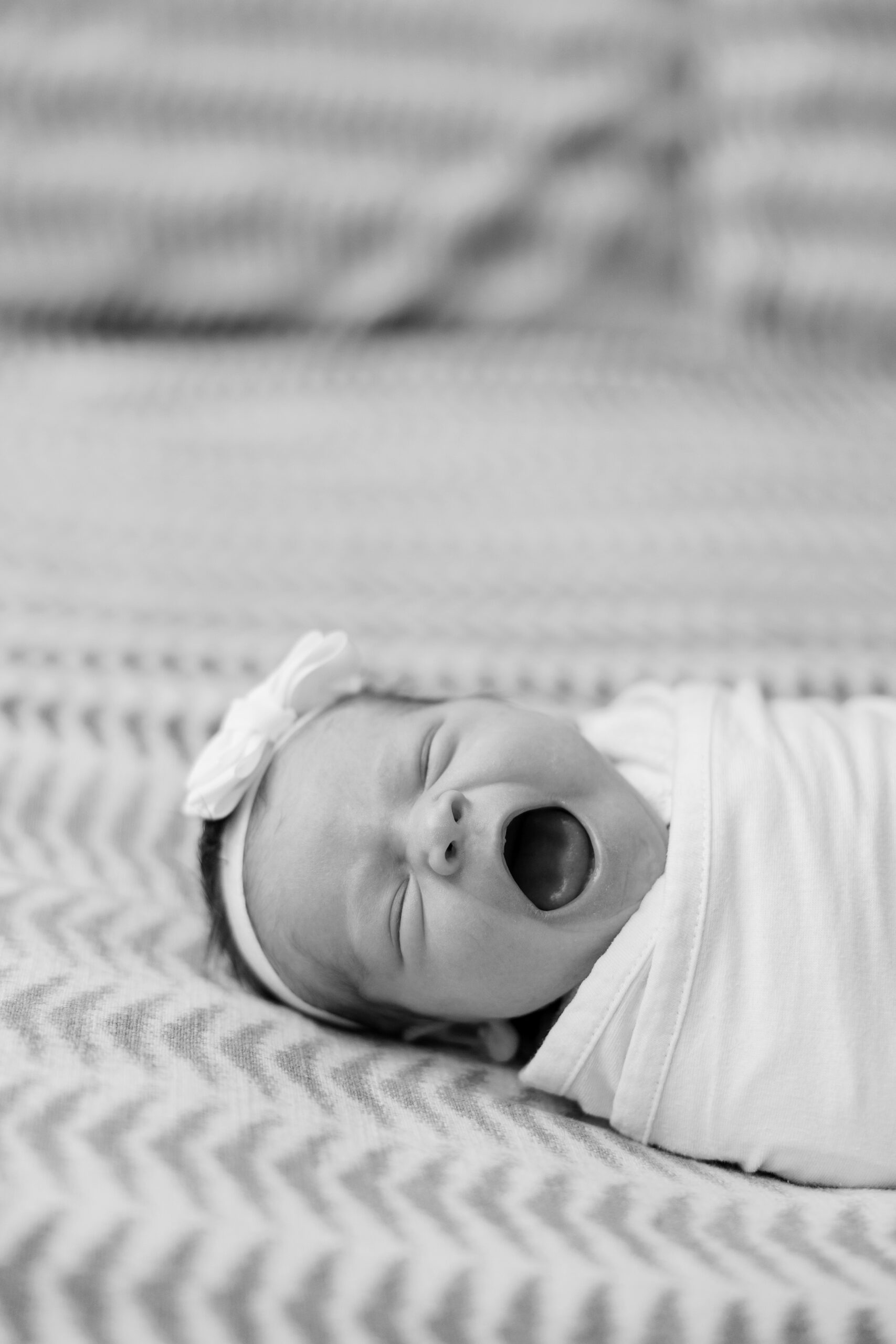 baby yawns at intimate at home newborn session