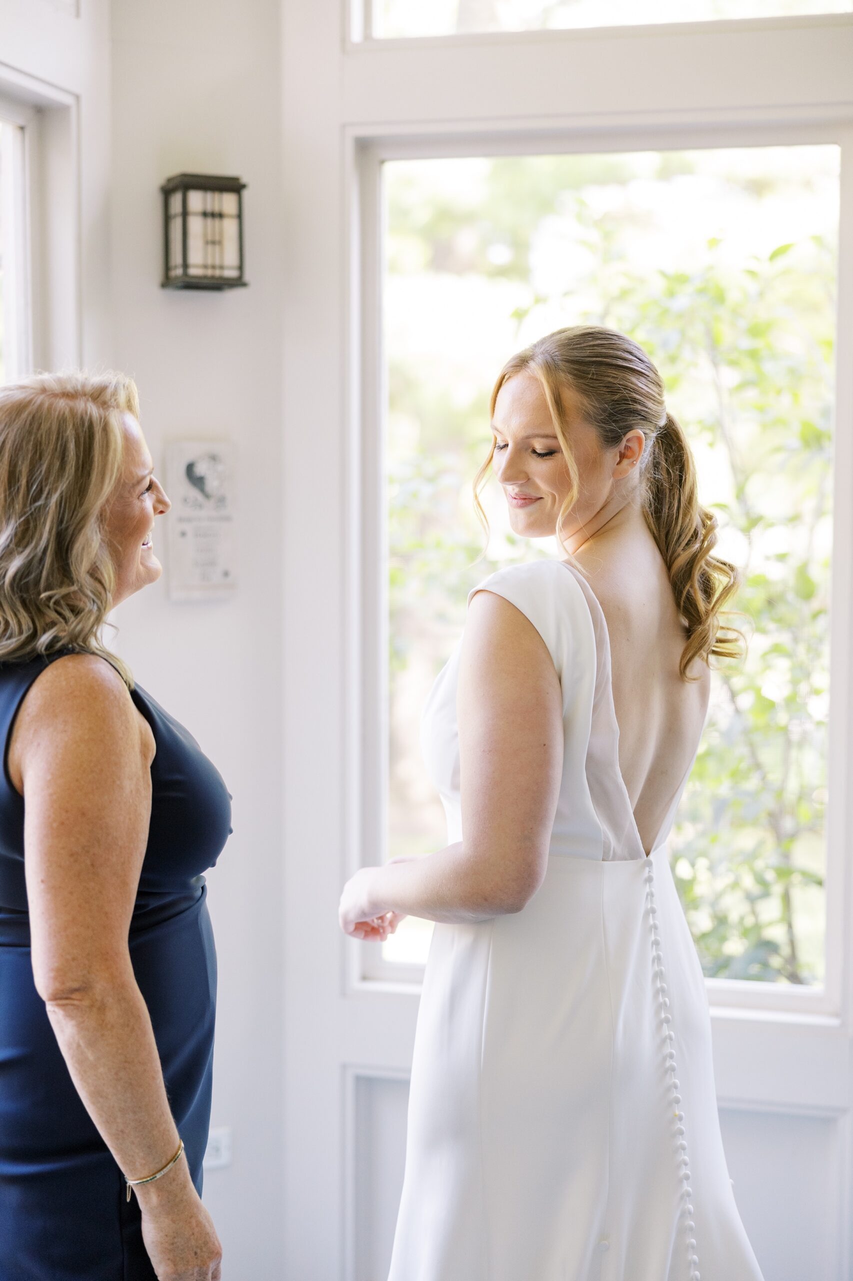 The bride got ready with her mother for her Westmoreland Country Club wedding