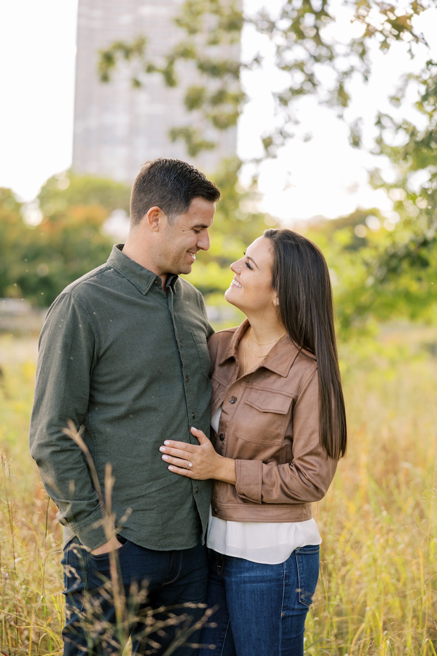 Couple smiles at each other during Chicago engagement session