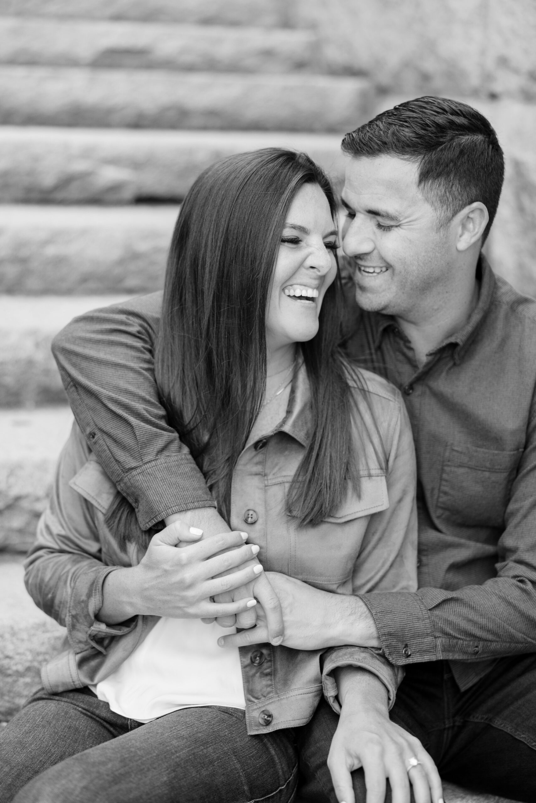 Man and woman smile at each other during Chicago engagement session