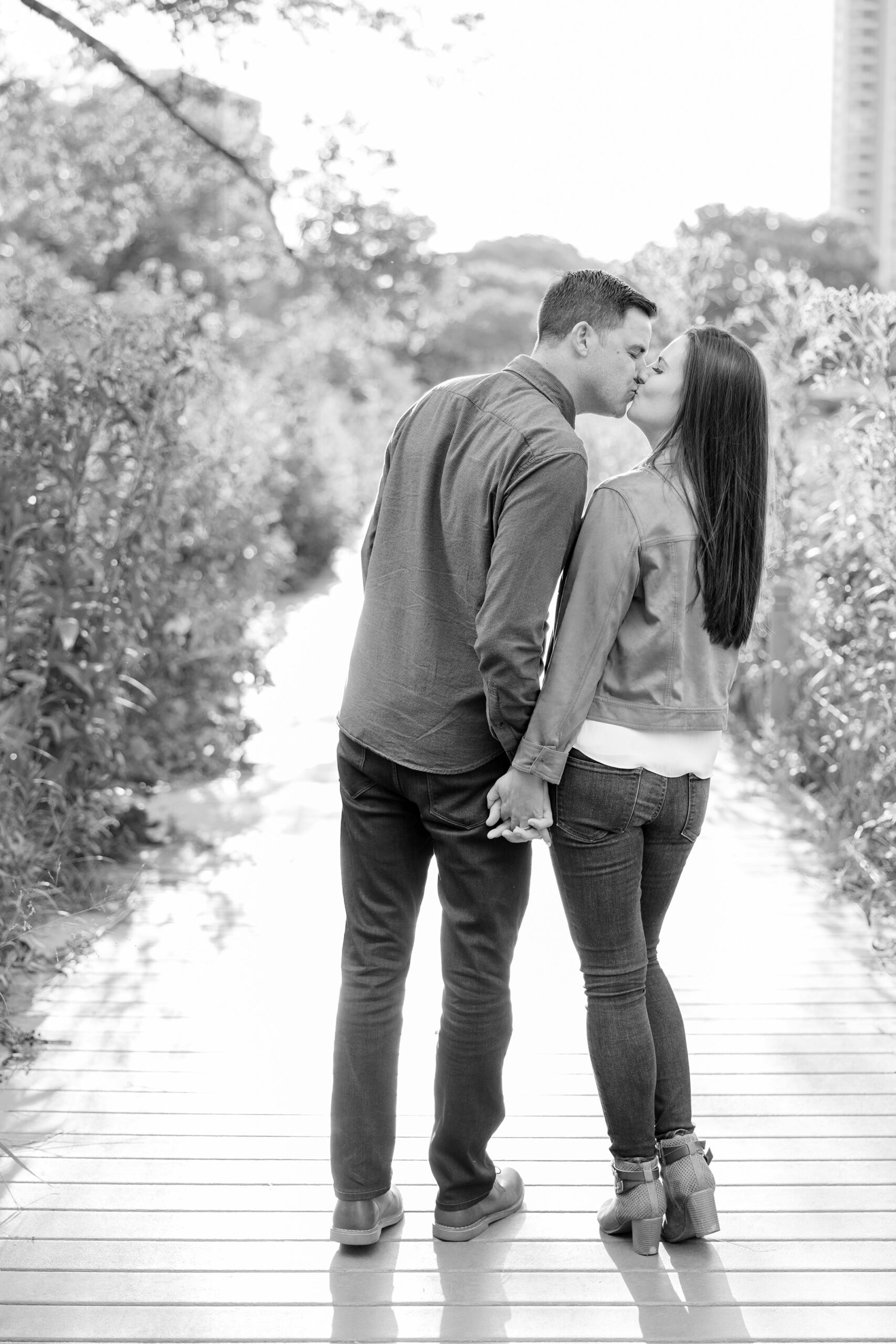 Man and woman kiss at Lincoln Park engagement photoshoot