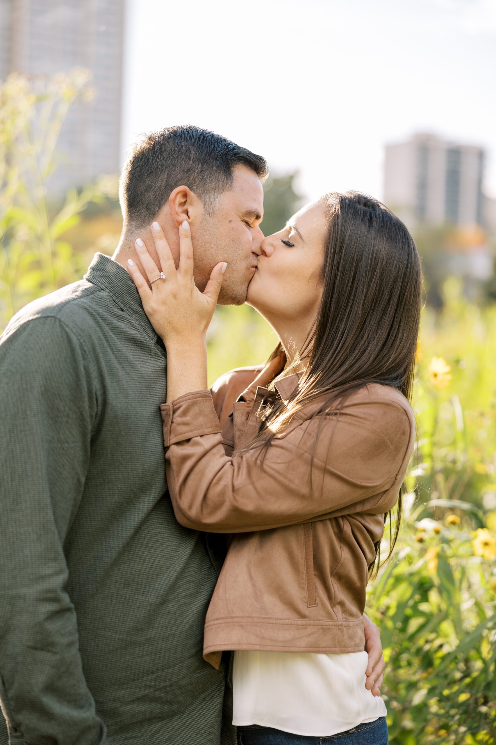 Man and woman kiss at fall Lincoln Park Zoo engagement session