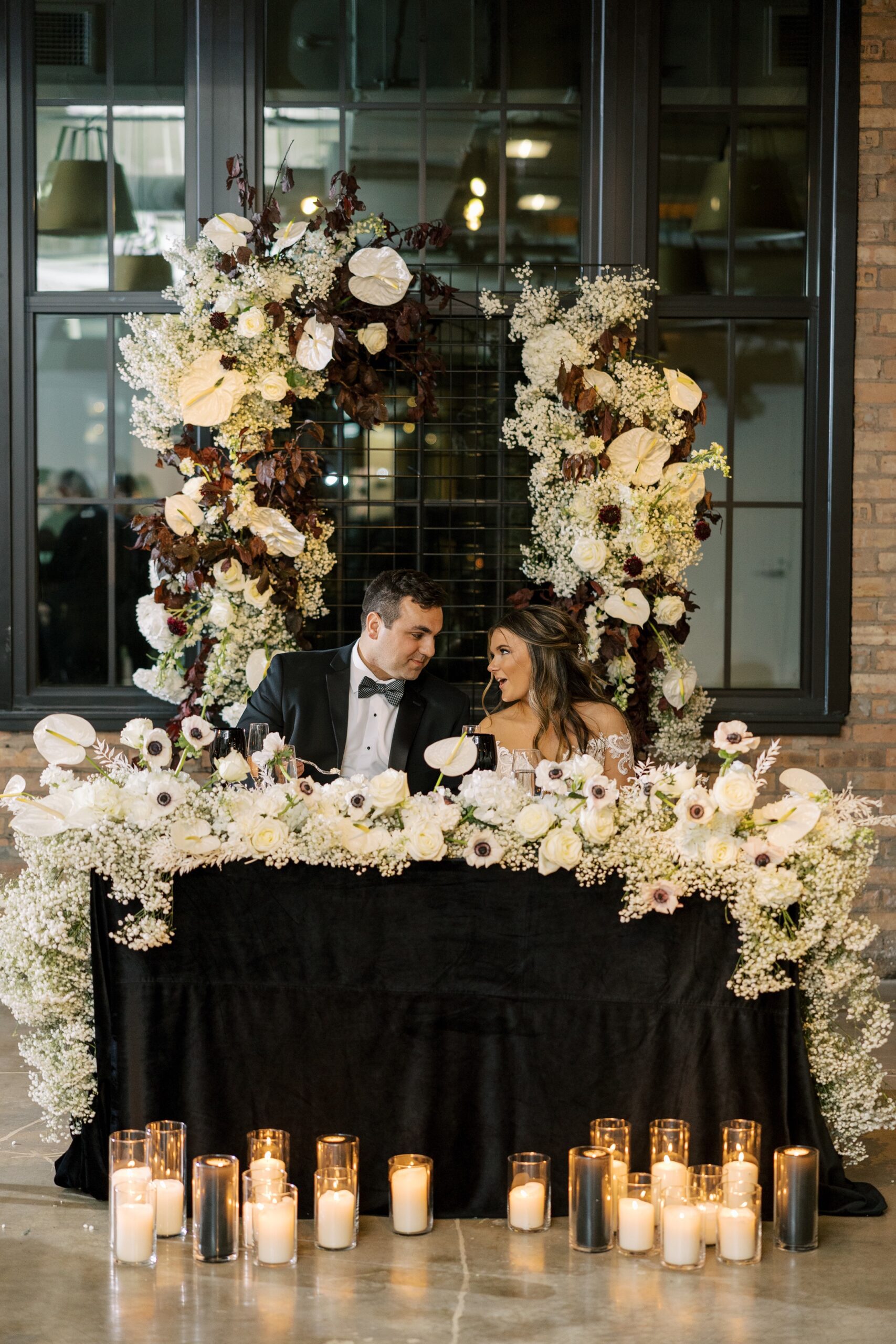 Bride and groom at their sweetheart table at the Old Post Office wedding reception