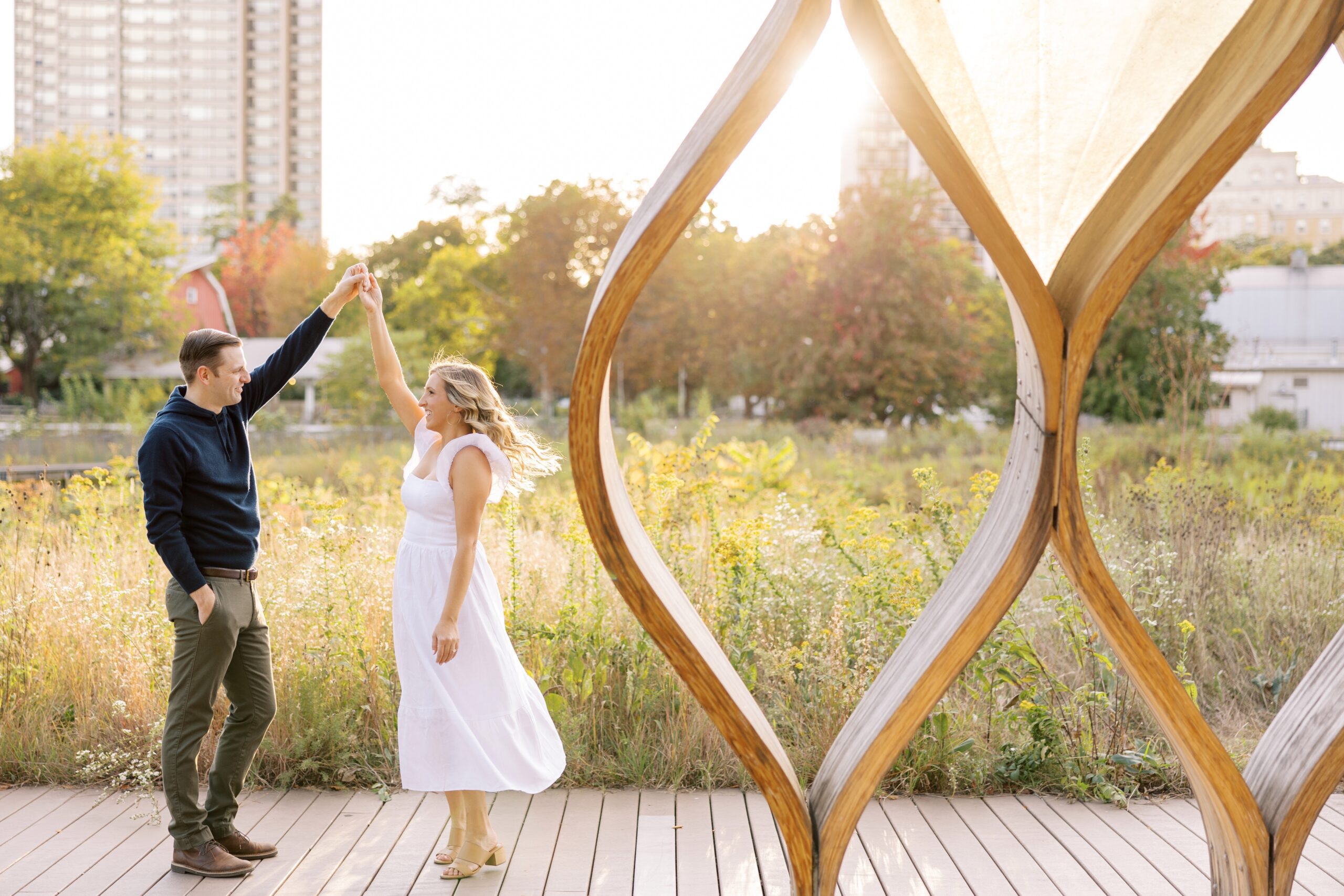 Man and woman dance in Chicago during engagement photo session