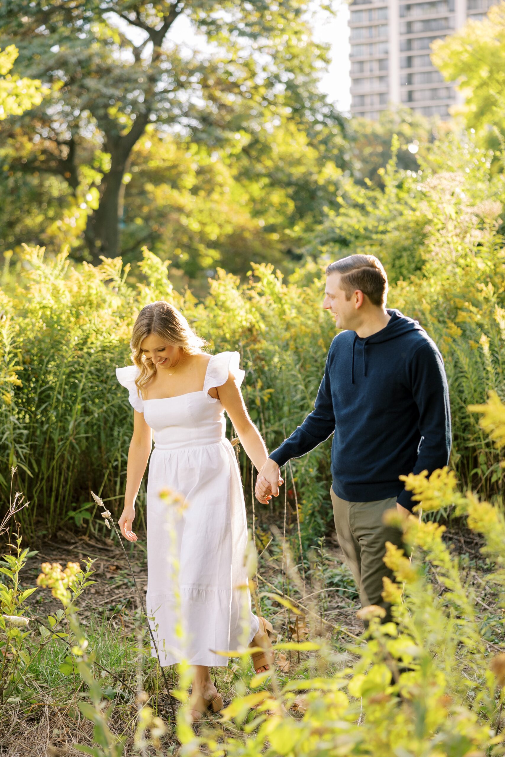 couple explores Lincoln Park Zoo during fall engagement photoshoot