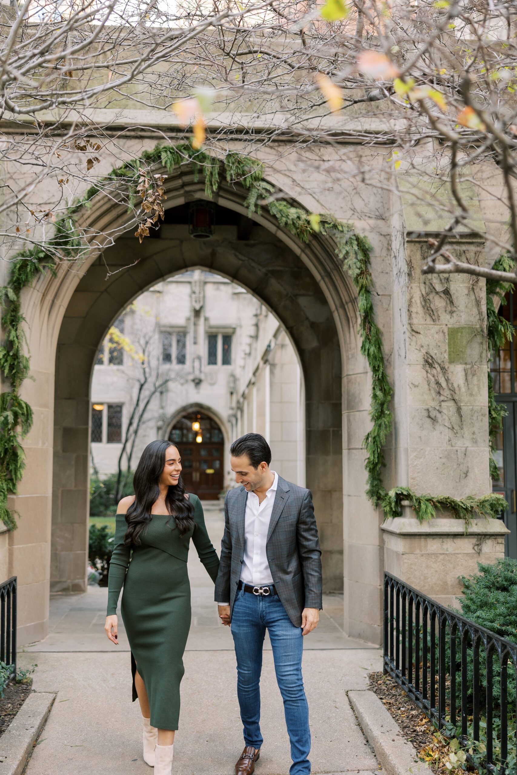 Man and woman hold hands during Chicago engagement shoot