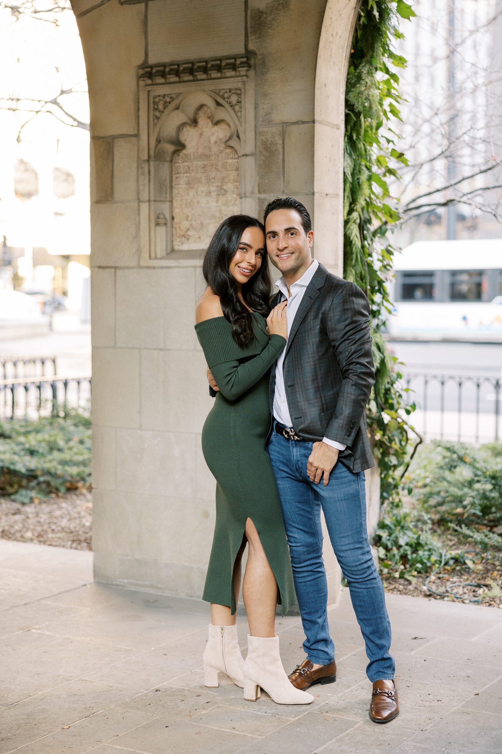 Man and woman smile at the camera during Chicago engagement session
