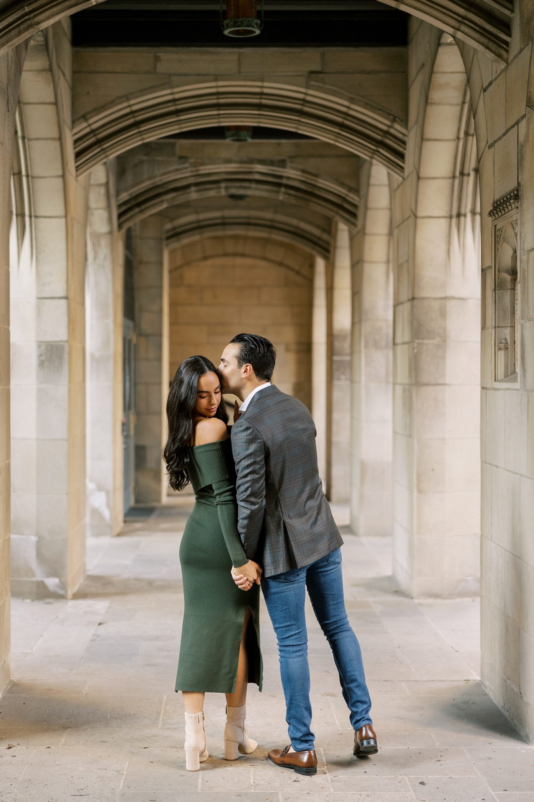 Man kisses woman on forehead during Chicago engagement session at Fourth Presbyterian Church