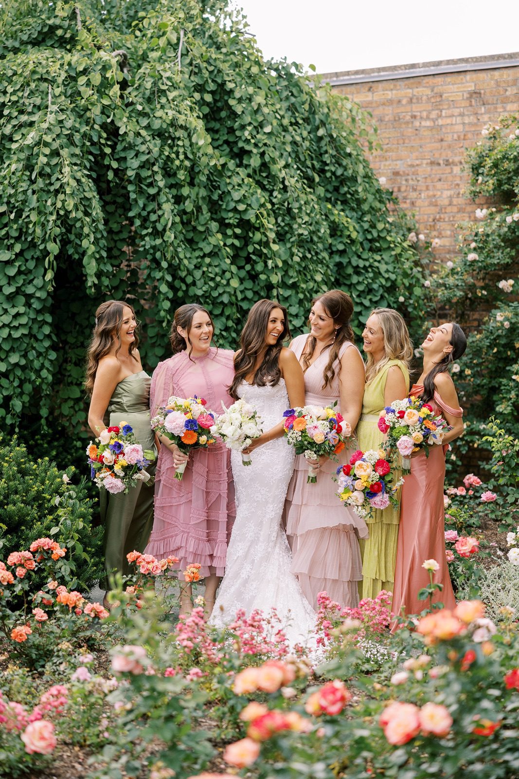 Bridesmaids pose for photos at the Chicago Botanic Garden wedding