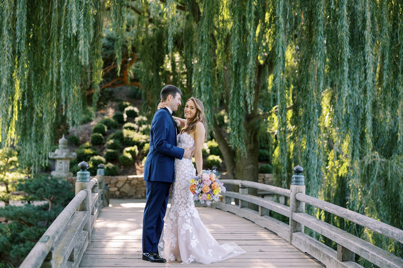 Bride and groom pose for couples portraits at their Chicago Botanic Garden wedding