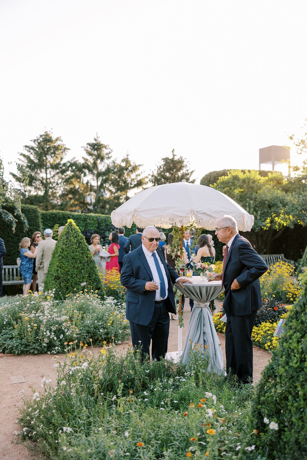 Guests enjoying outdoor cocktail hour at the Chicago Botanic Garden wedding