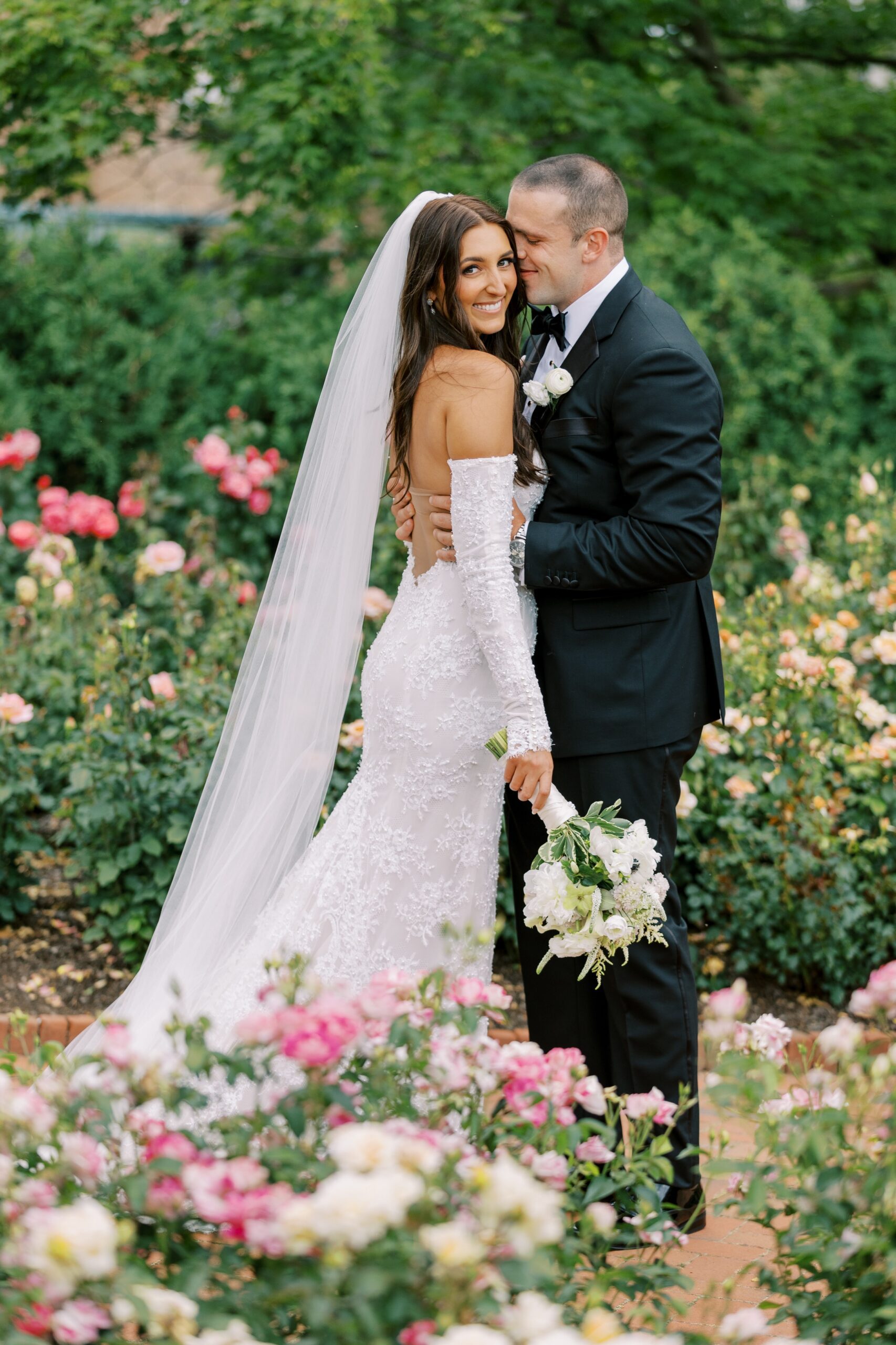 Bride and groom pose in the Rose Garden at Chicago Botanic Garden