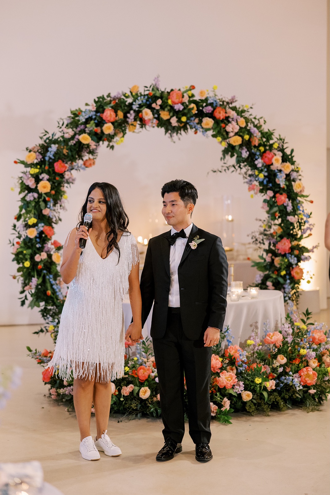 Bride and groom give a toast at the wedding reception