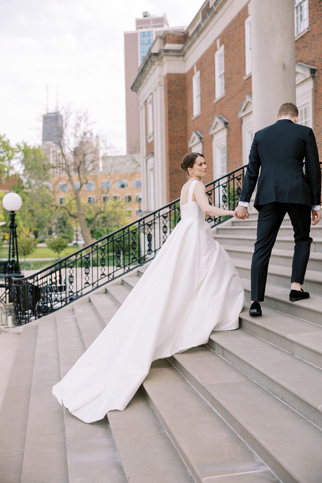 Bride and groom on the stairs of the Chicago History Museum